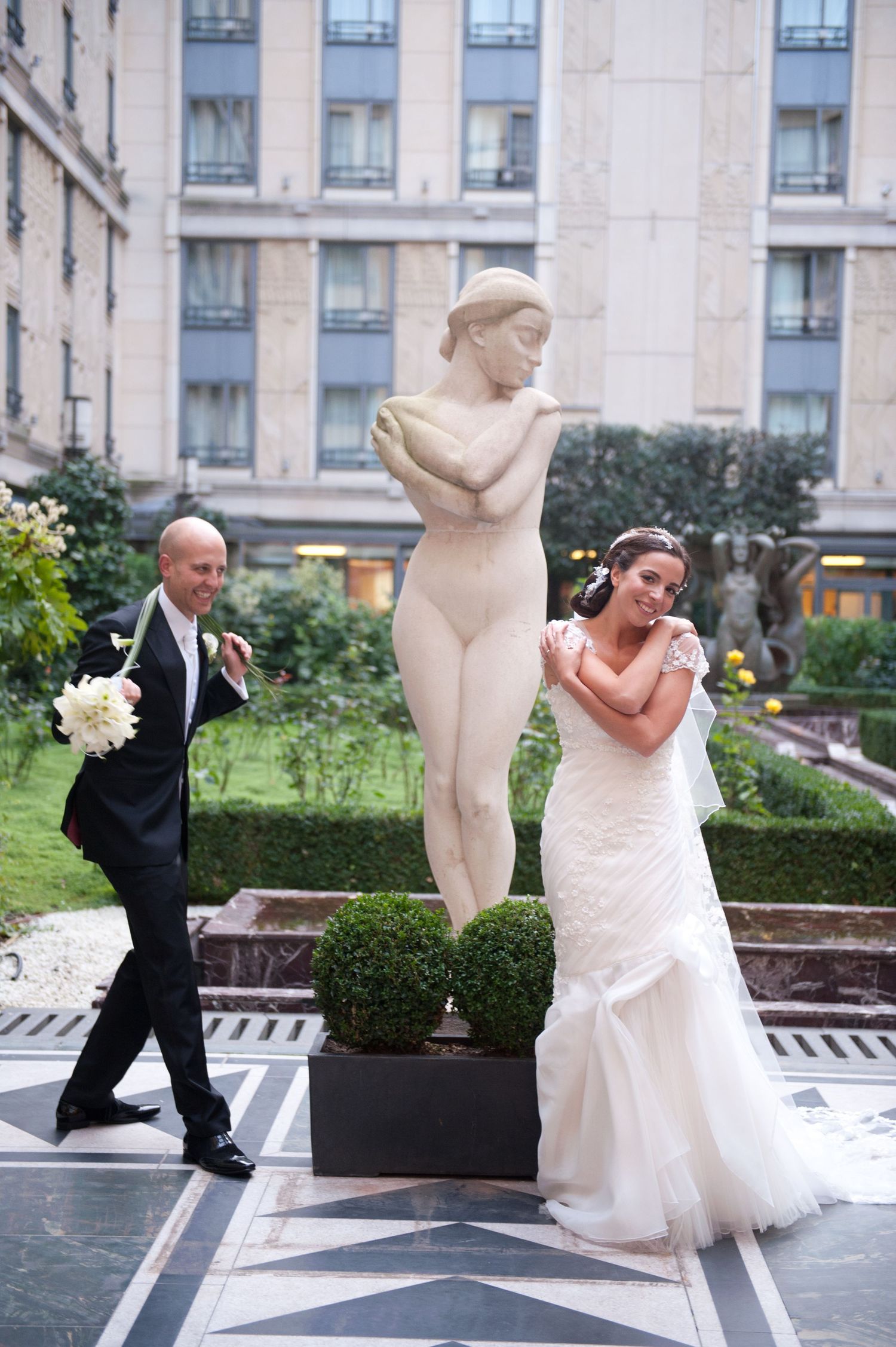 A sequence of wedding photos showing playful poses between the couple in front of an urban building.