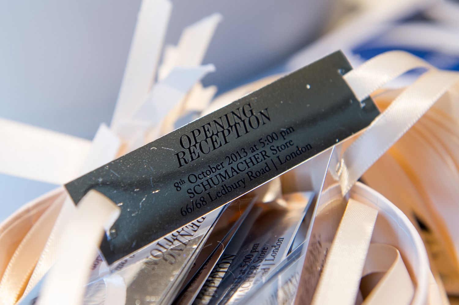 Close-up of printed name cards and event materials arranged on a table.