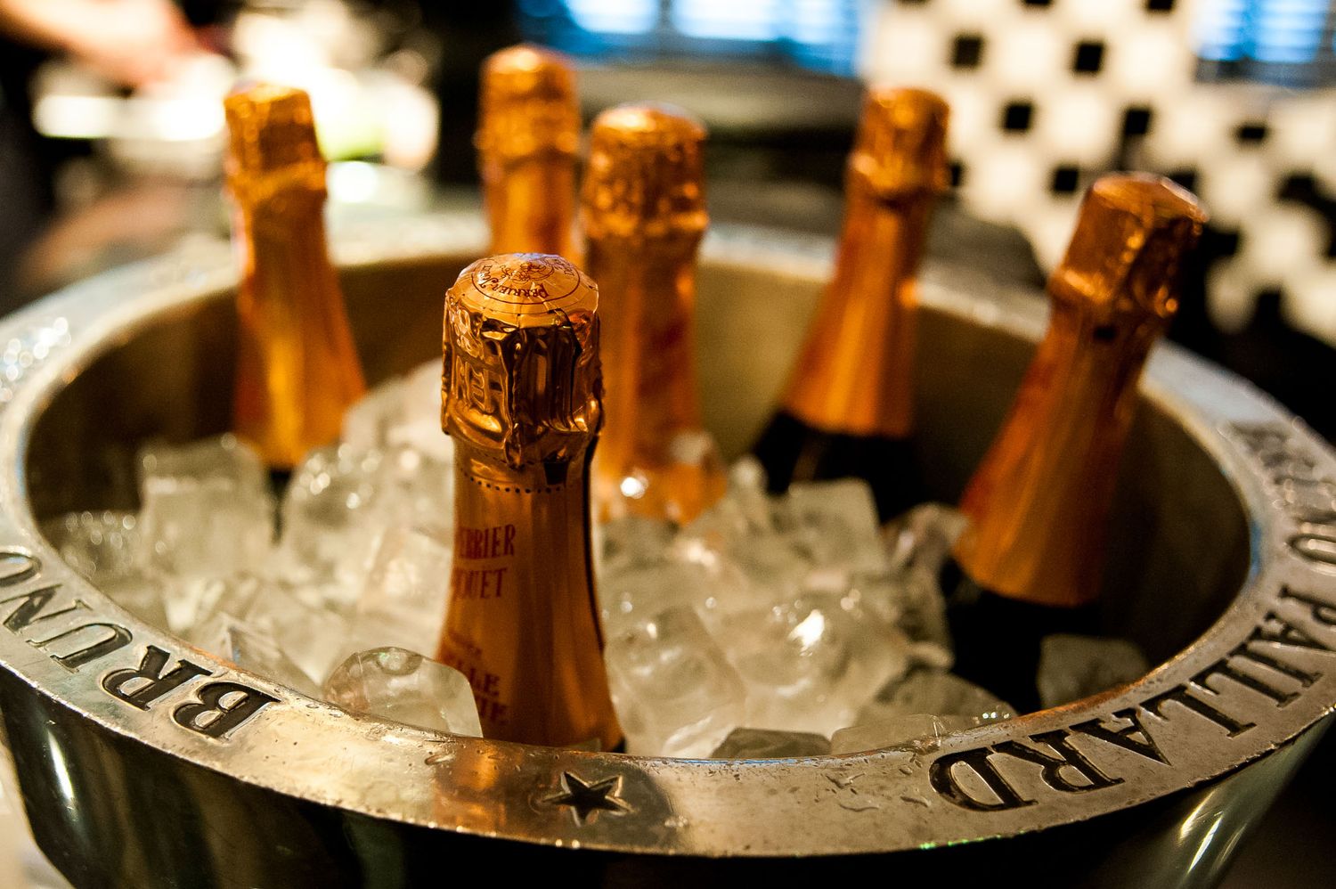 Champagne bottles chilling in ice buckets with elegant presentation.