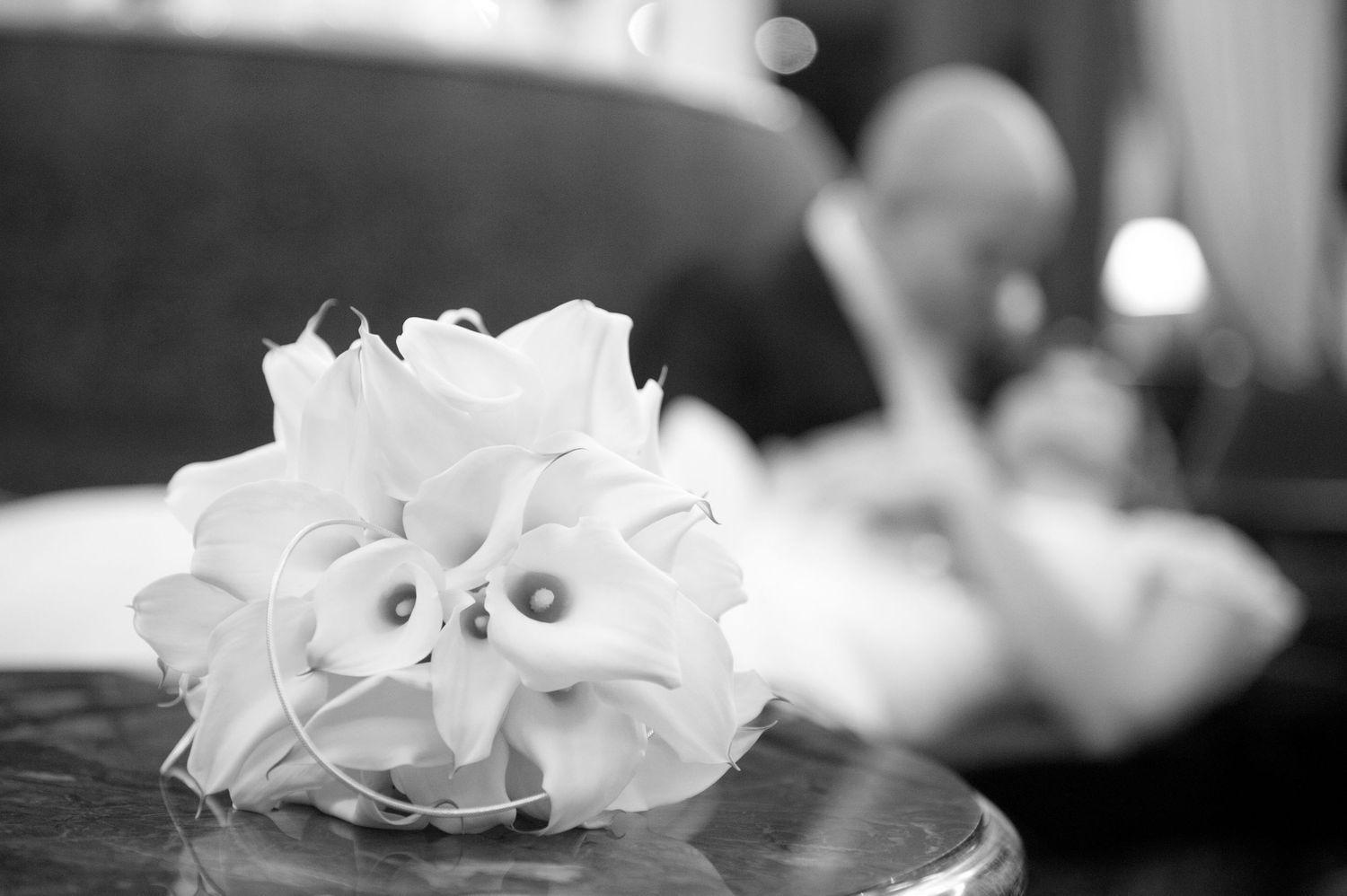 Black and white close-up photograph of delicate white orchid petals arranged in an artistic composition.