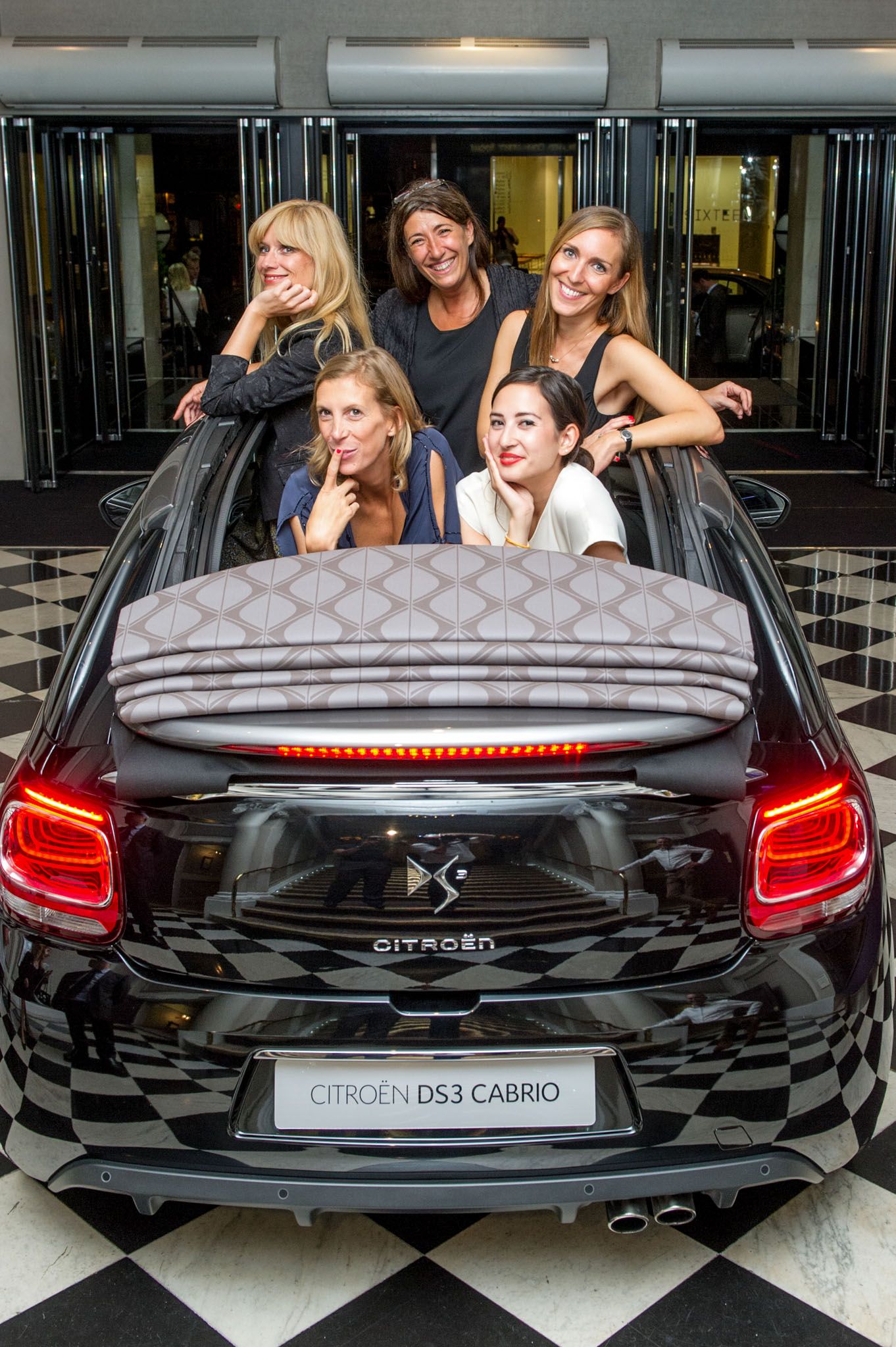 Black Citroen DS5 Cabrio convertible shown from rear view with distinctive taillights.