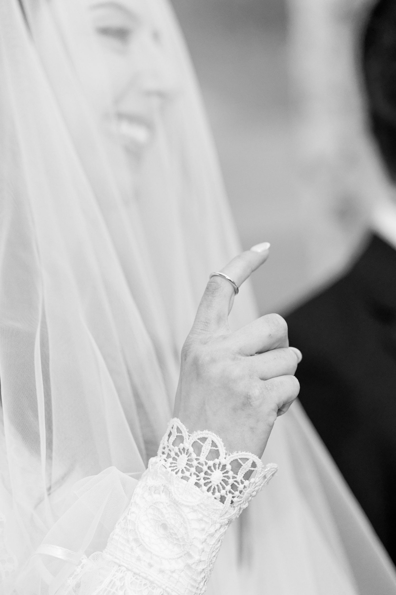 A close-up series of black and white photos showing hands holding cigarettes with delicate lace details in the background.