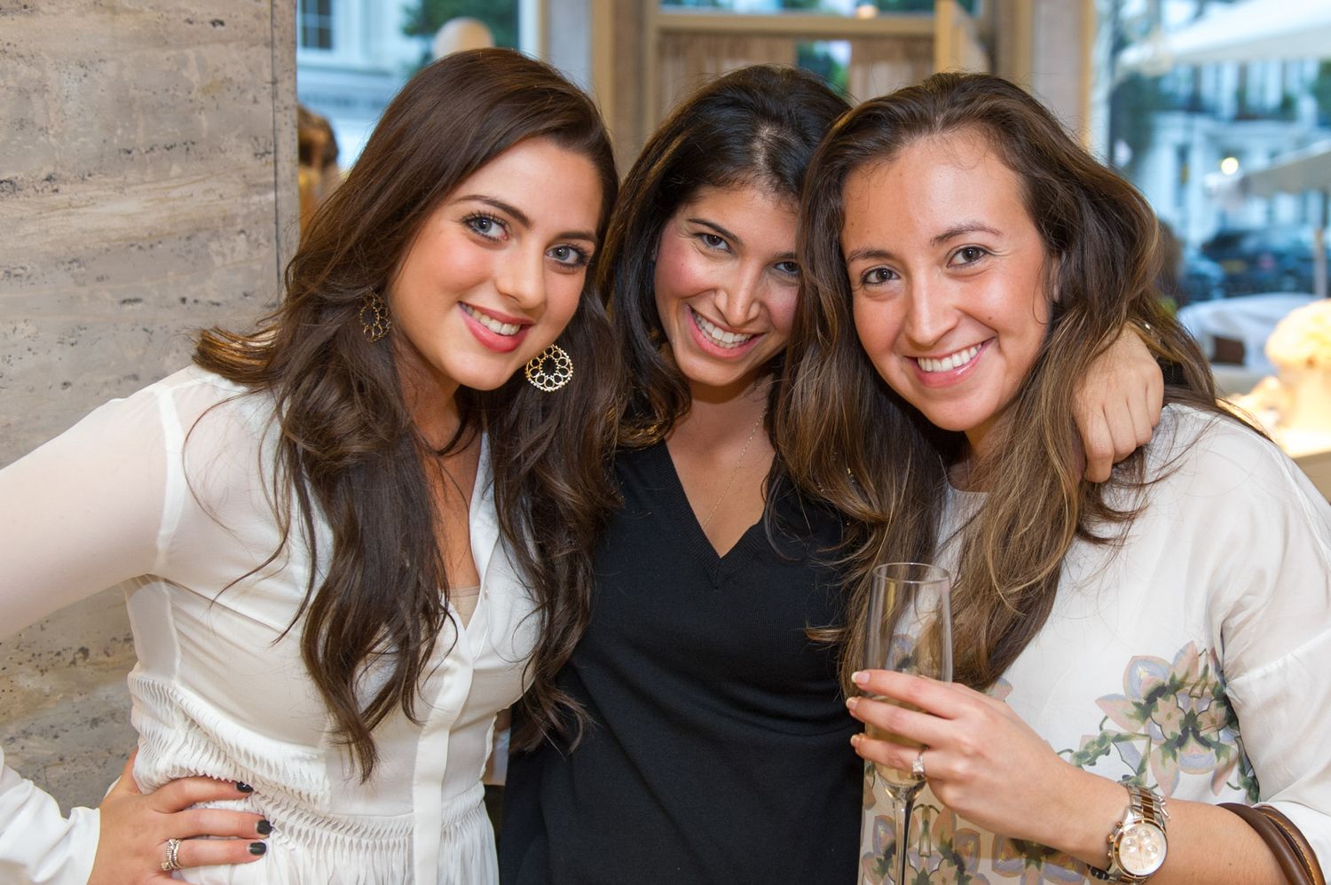 Group of friends posing together at a social gathering.