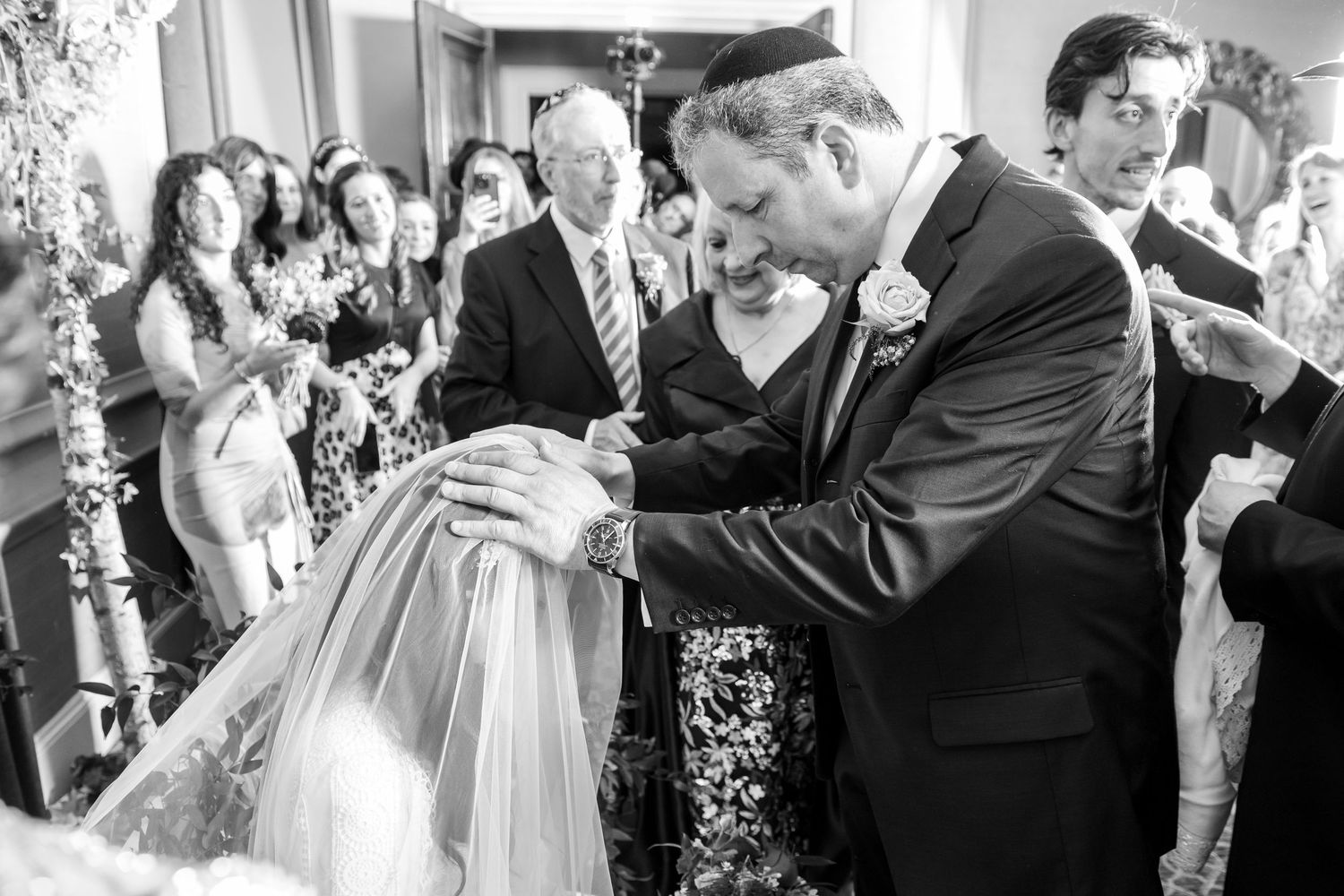 A sequence of black and white wedding photos showing couples dancing and embracing at an elegant reception celebration.