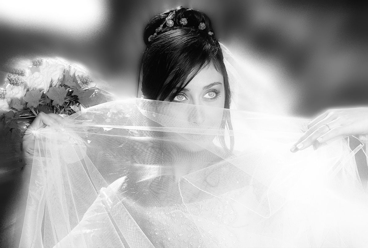A black and white artistic wedding photo series showing romantic moments between a couple in formal attire.