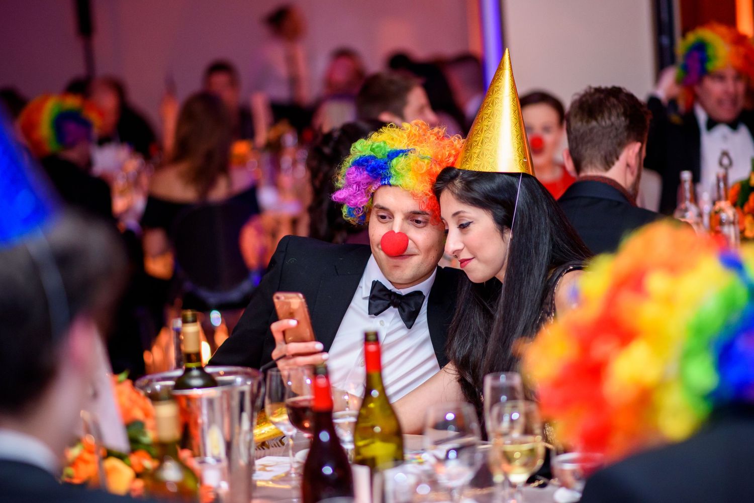 Colorful party decorations and ambient lighting at formal dinner gala.