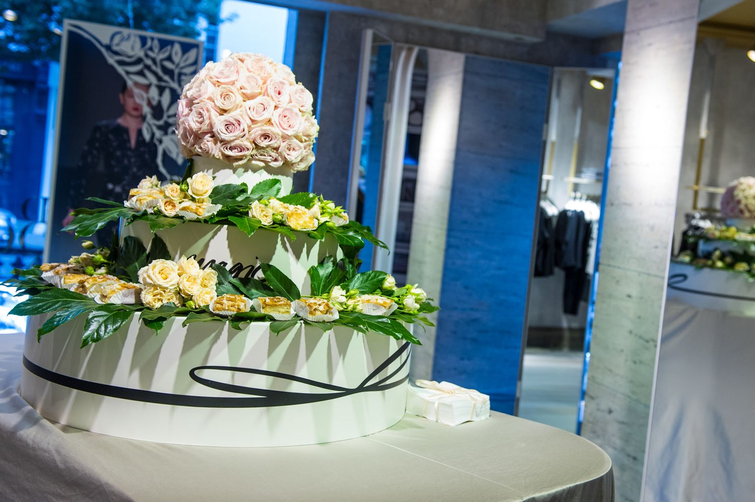Elegant floral centerpiece with white roses on display at formal event.