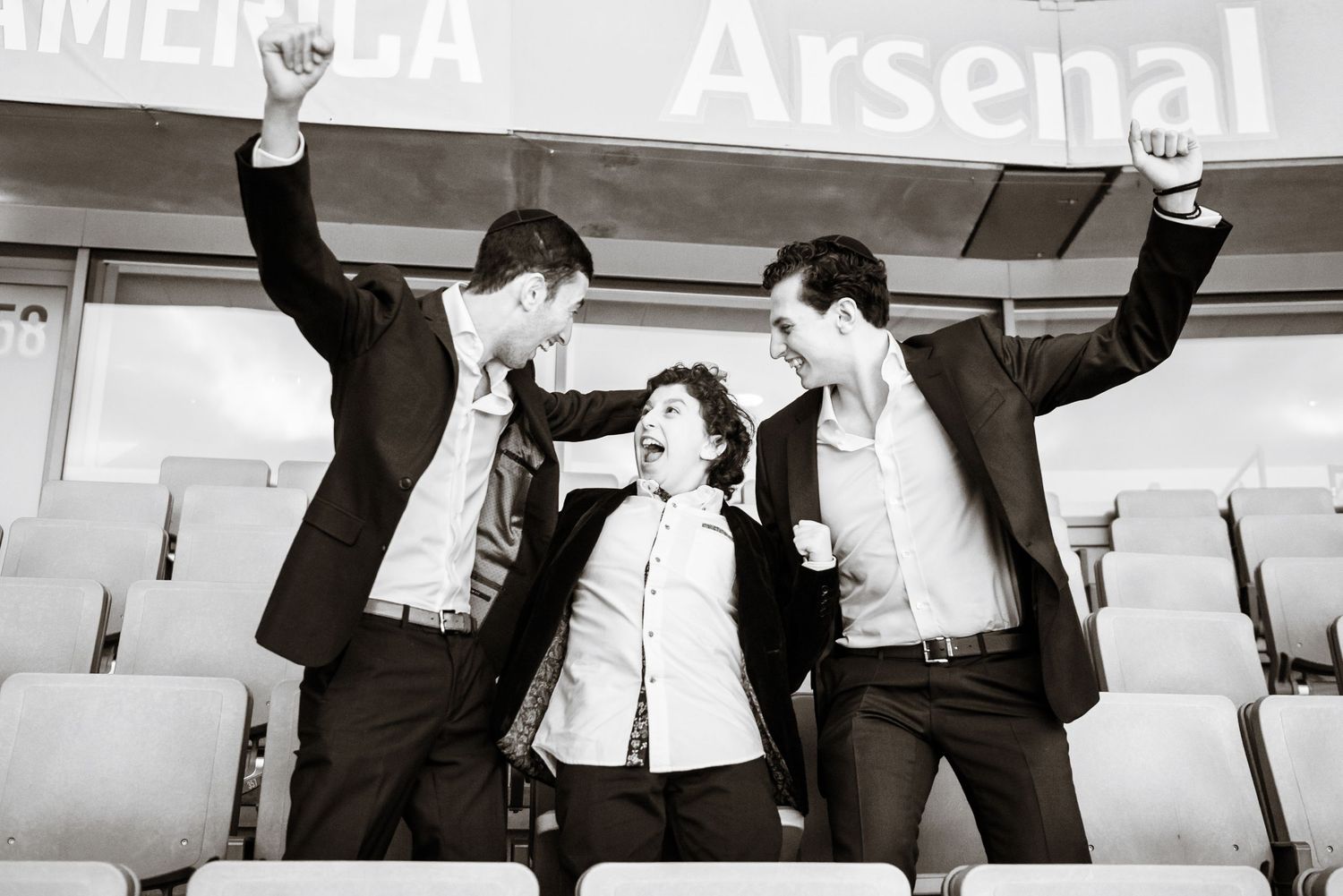 A series of black and white photos showing people dancing and moving energetically in what appears to be a dance studio.