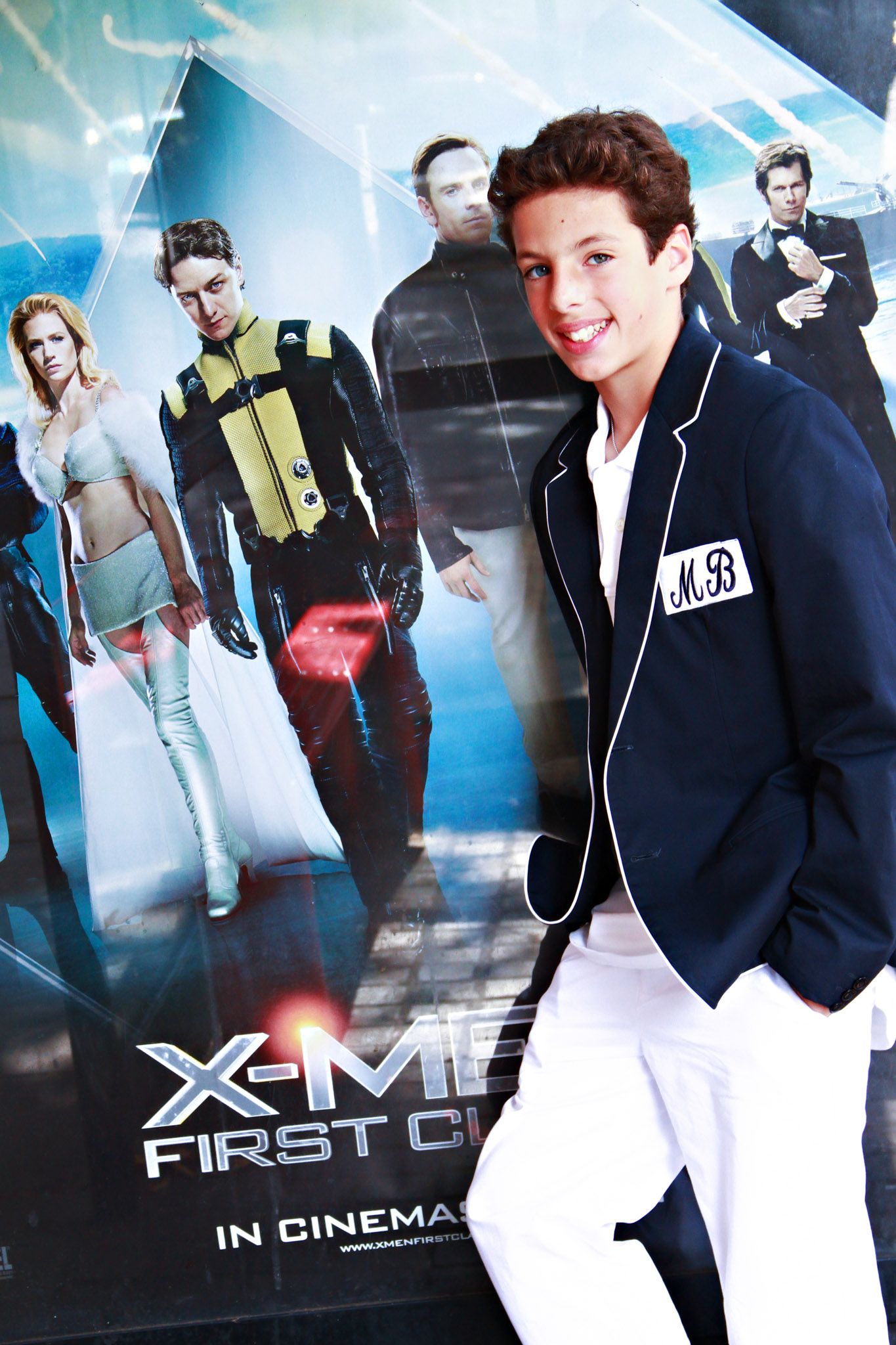 Movie promotional images showing figures in navy blazers and white pants against a blue background.