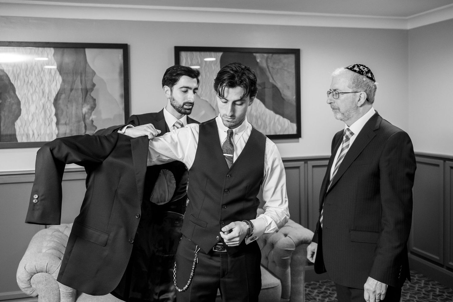 A collection of vintage black and white photographs showing people in suits and formal attire in various business settings.