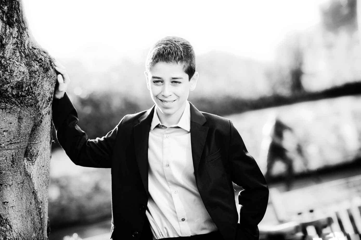 A black and white collage of portraits showing formal attire and smiling expressions.