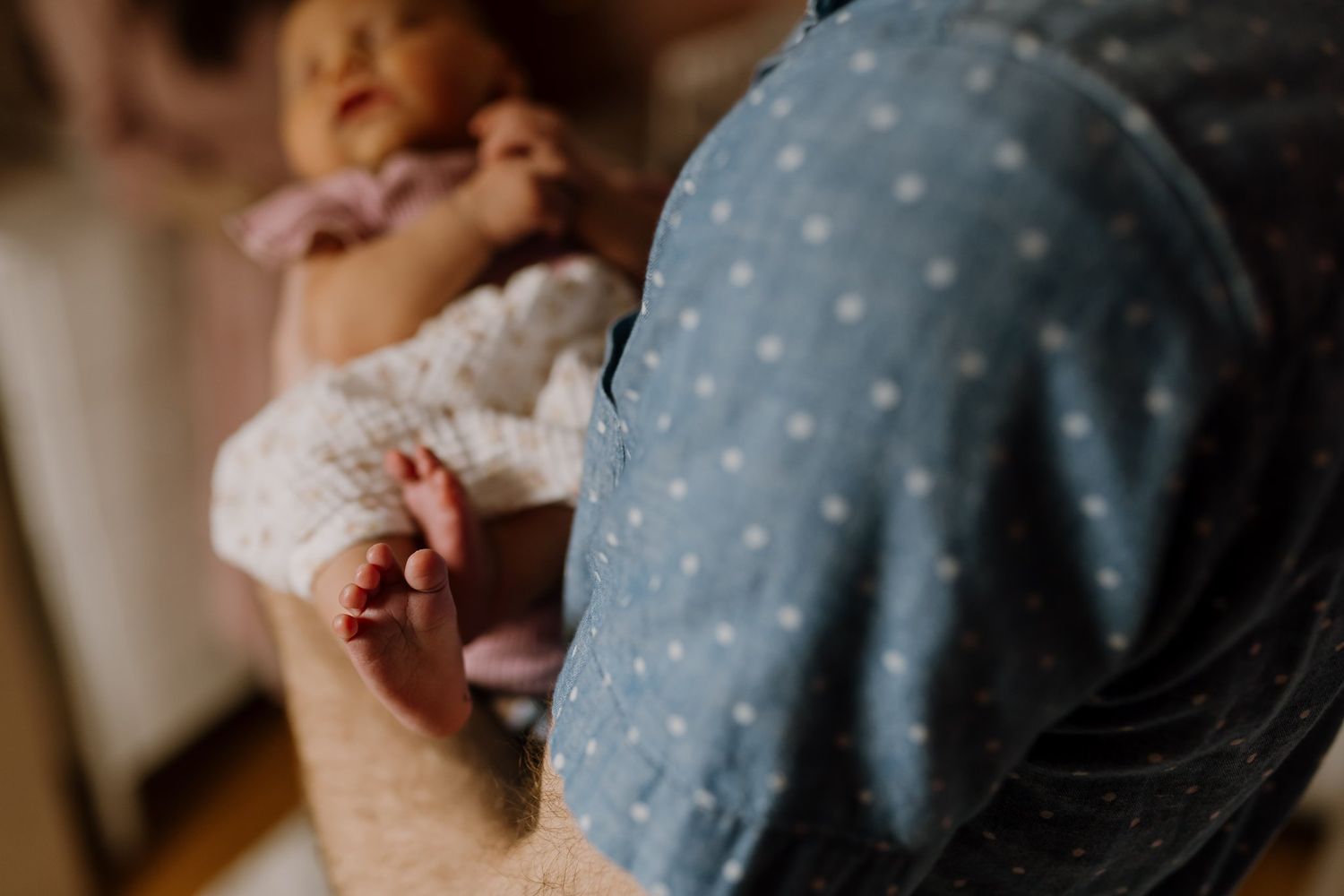 Dad holds his baby girl