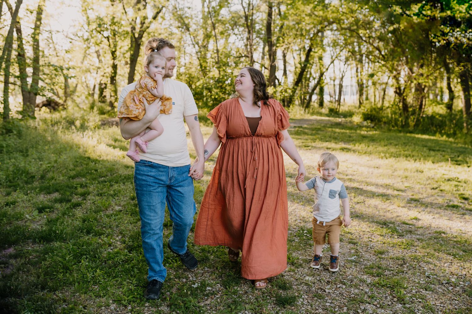 Family walks through sunshine together