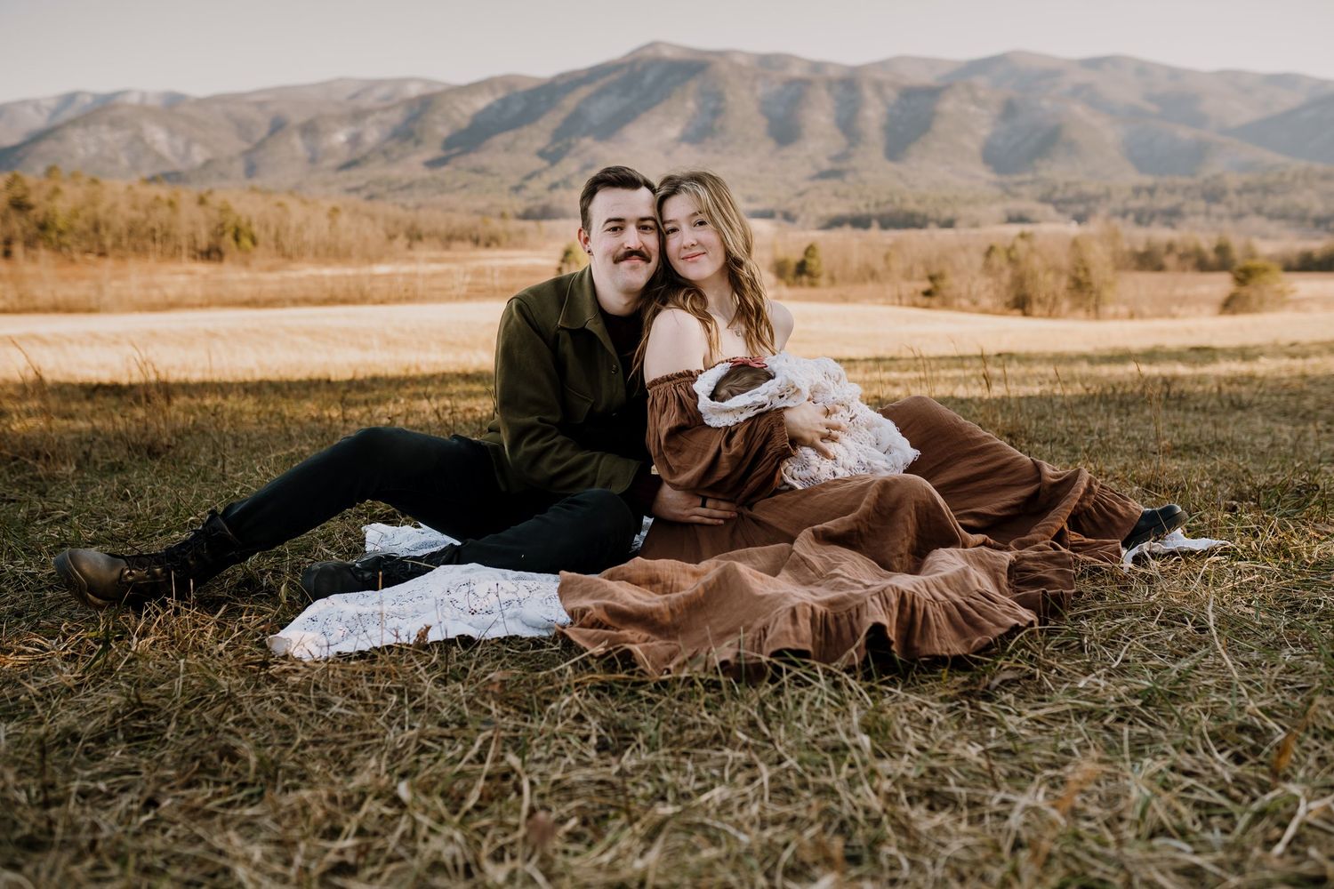 family in cades cove poses for pictures