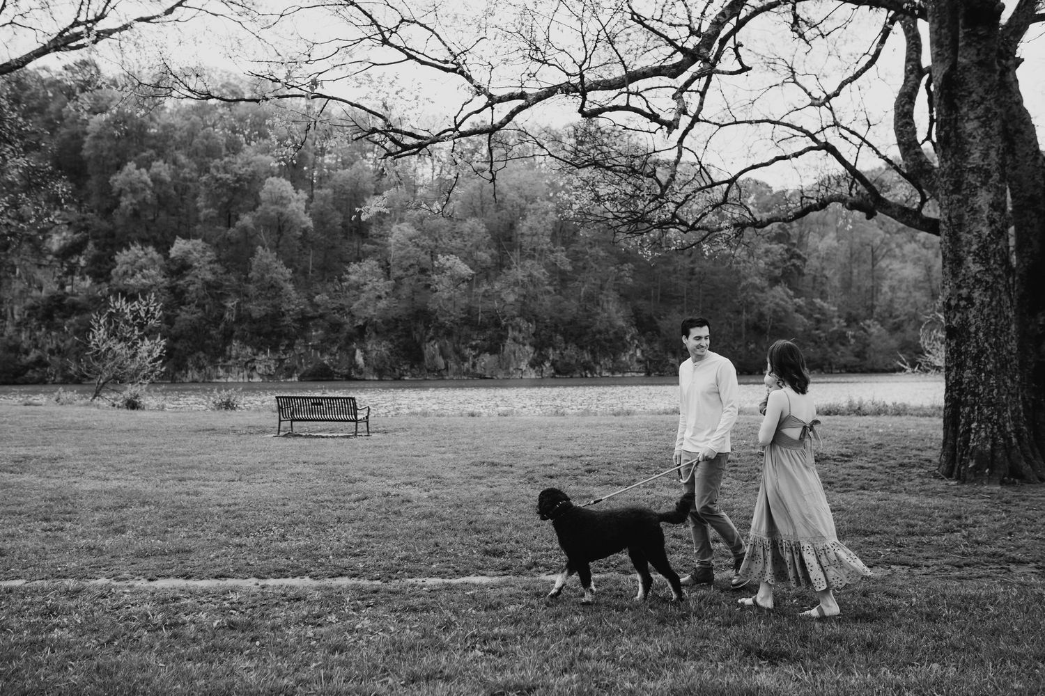 Family walks with their dog through Sequoya Hills Park for family photos