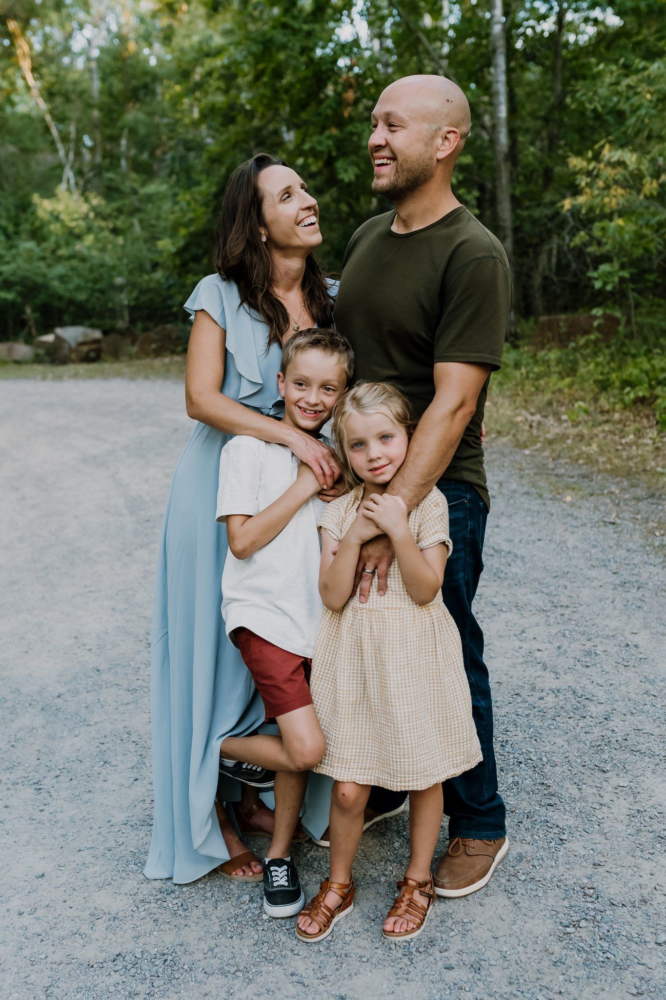 Parents laugh with their kids as they have fun together
