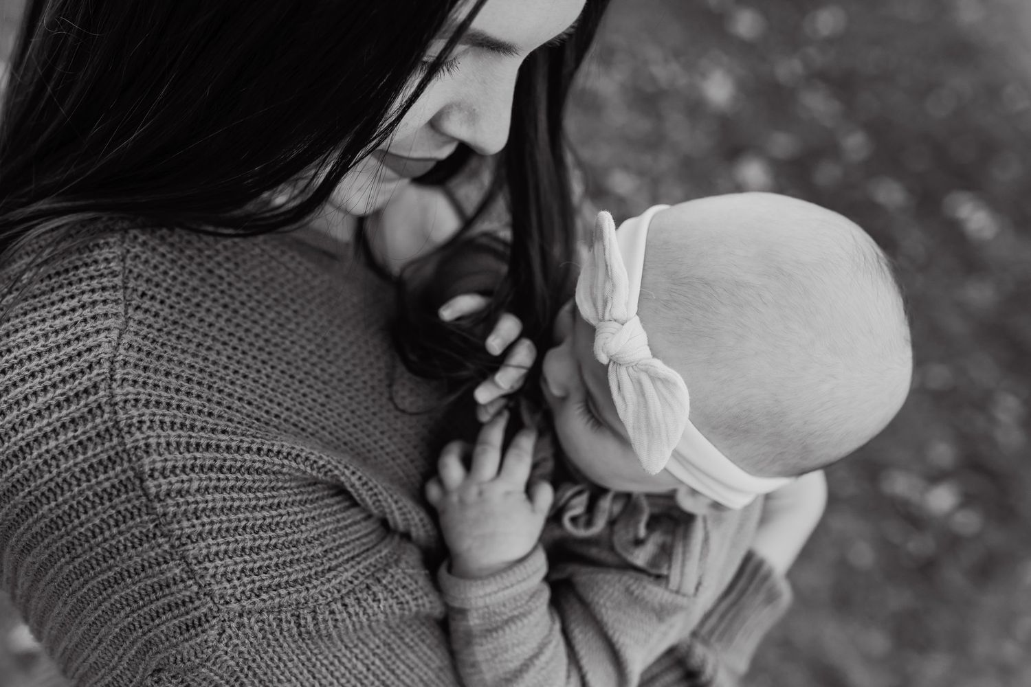 Mom snuggles daughter after choosing West Knox family photographer