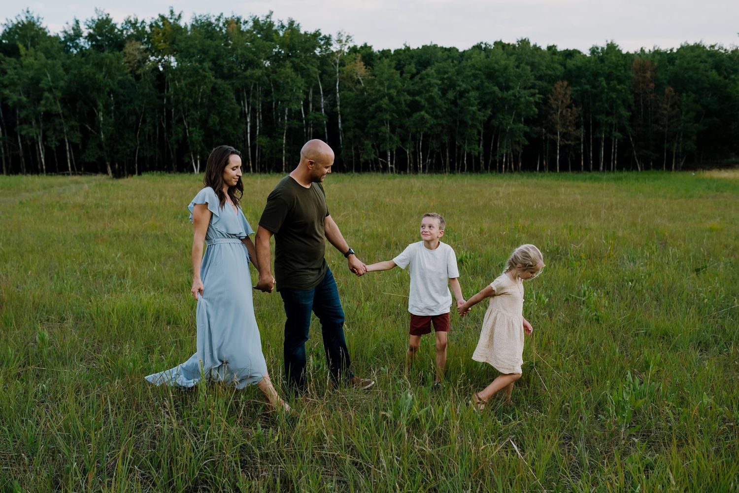 Family walking through a field