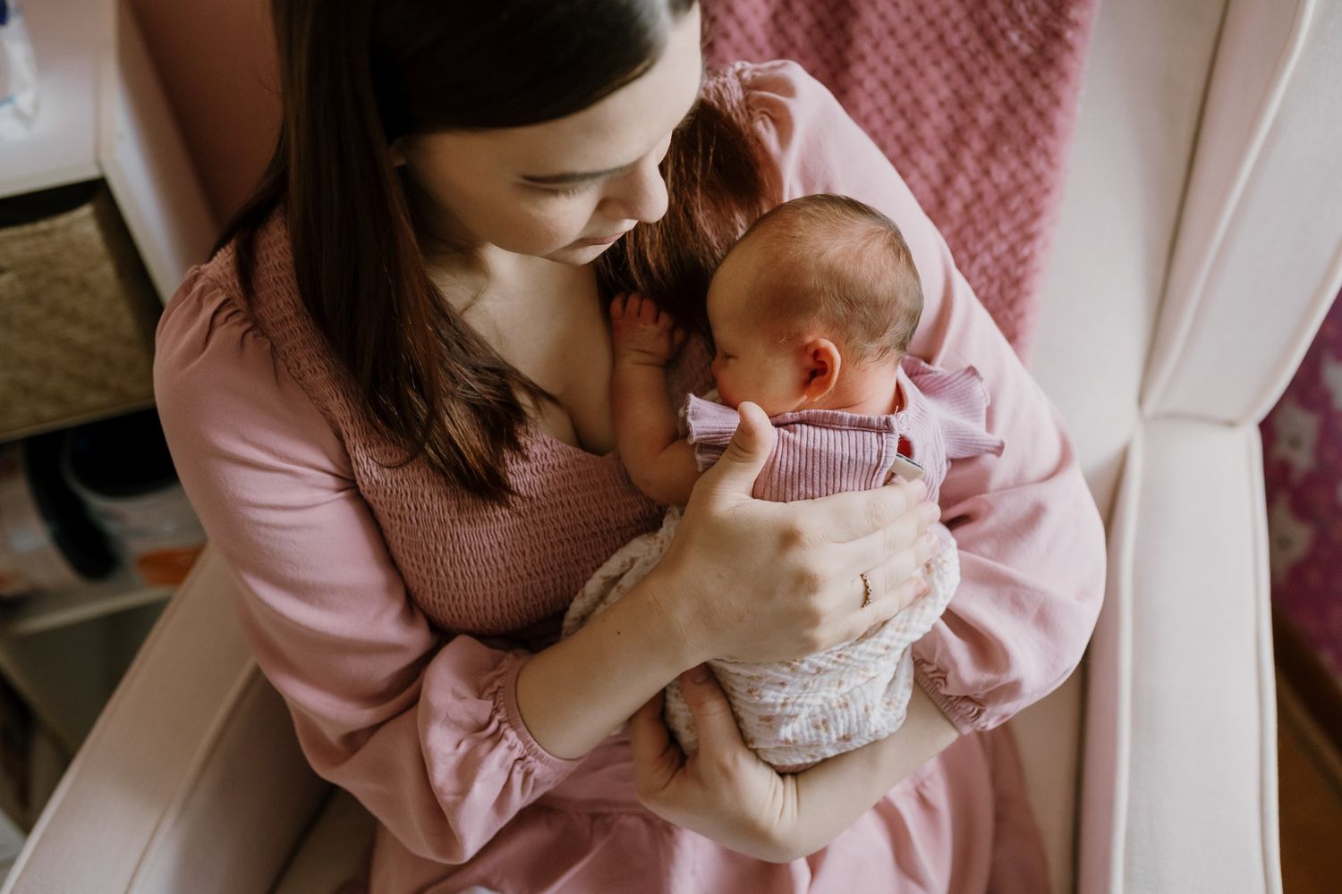 Mom burps her sleepy newborn during maryville lifestyle newborn photos