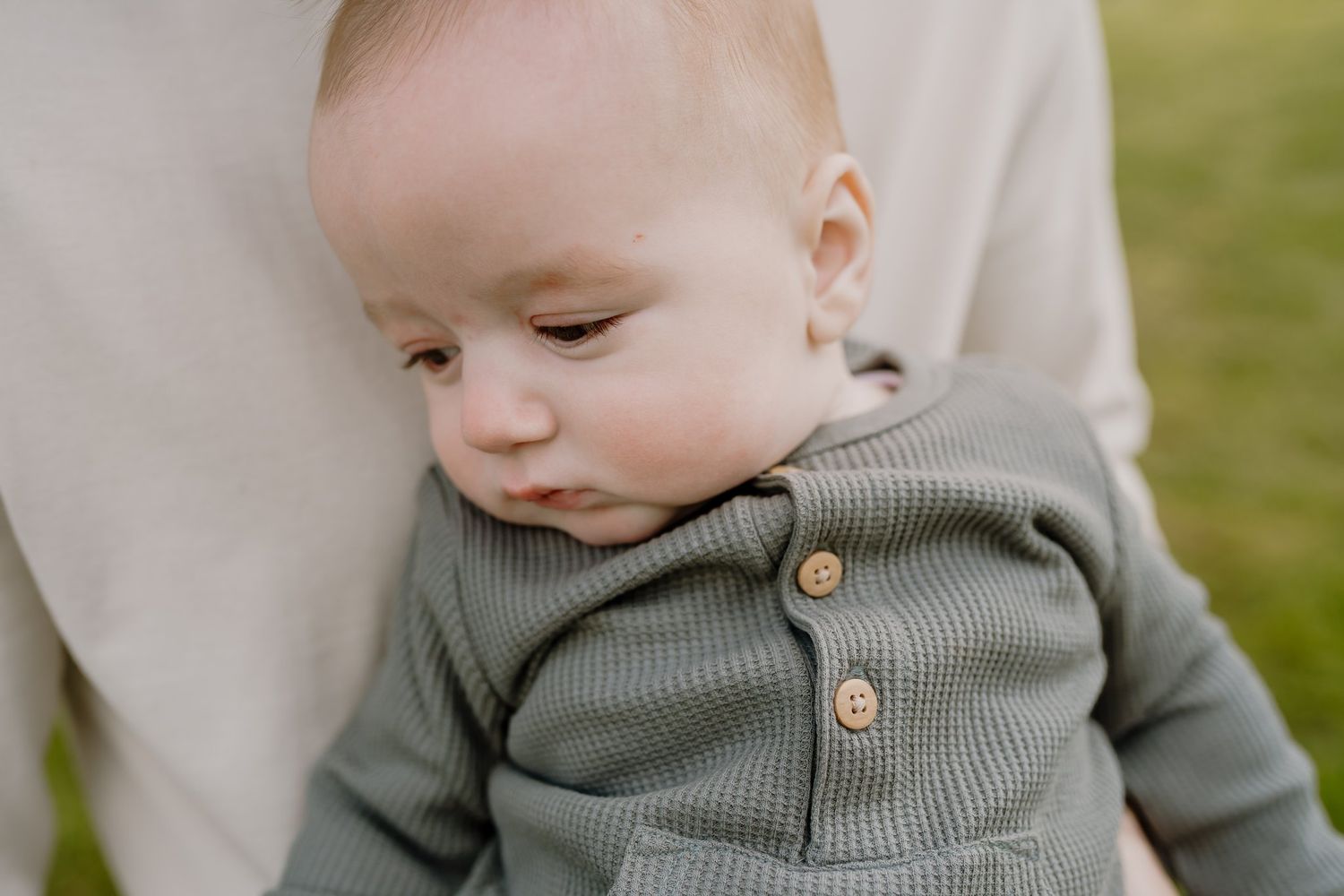 Baby being held by dad