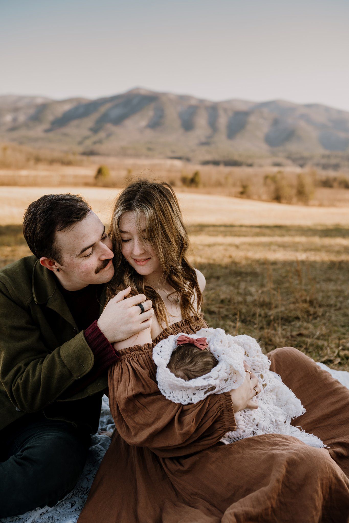 family poses in great smoky mtns for family photos on vacation