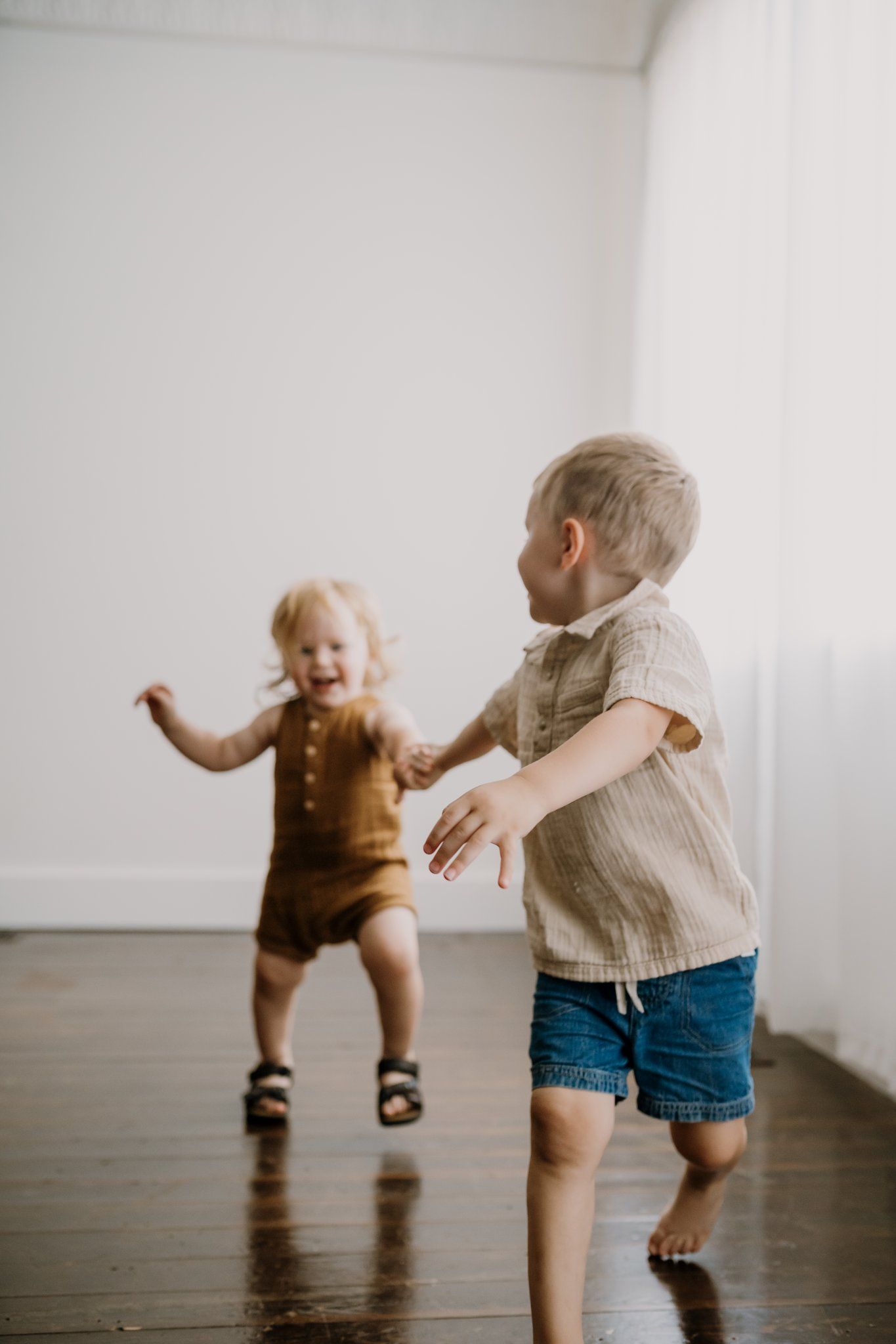Brothers play in natural light studio