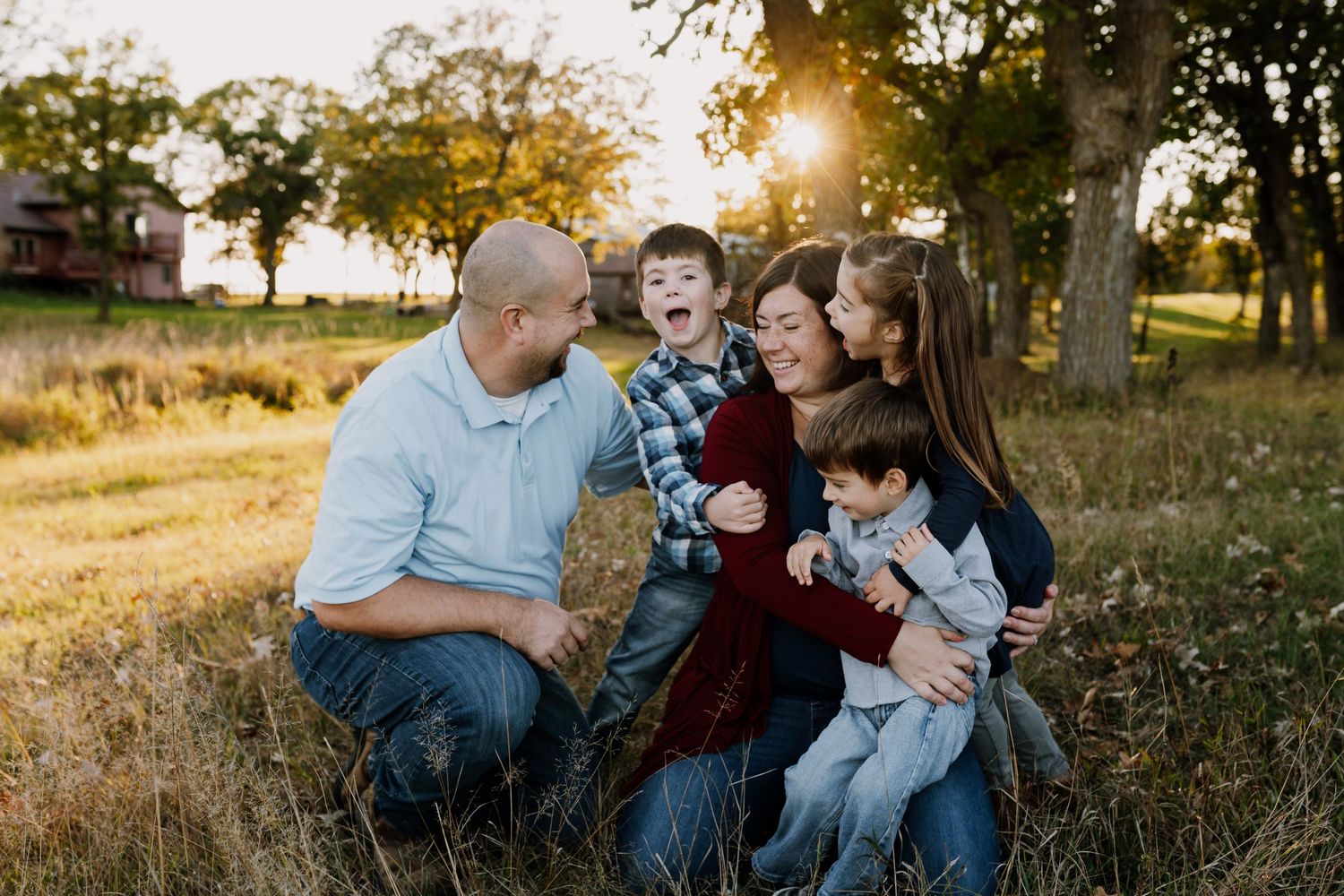 Family of five plays together during session with fun family photographer Knoxville Tennessee