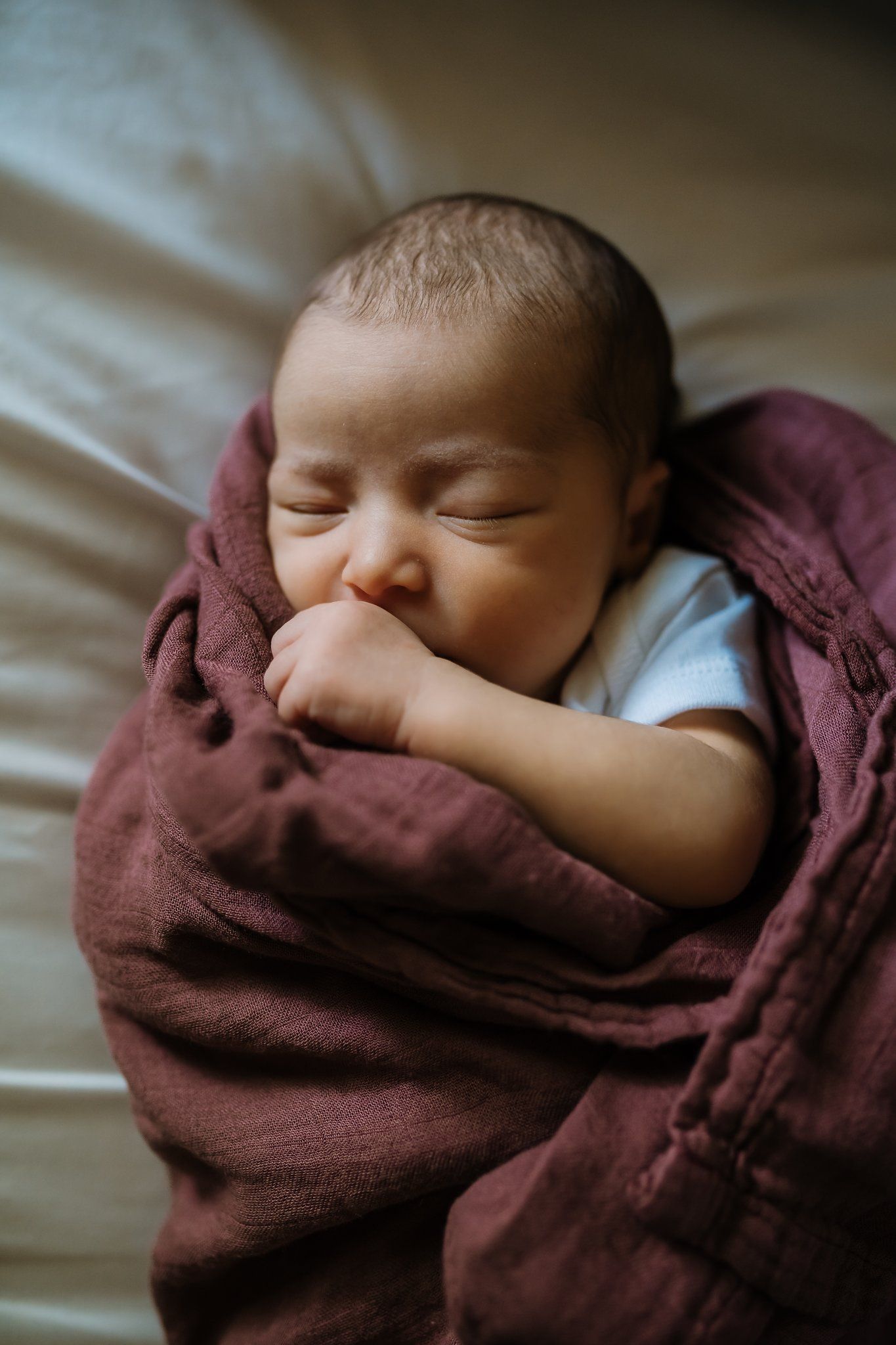 Newborn baby sleeps during in home pictures