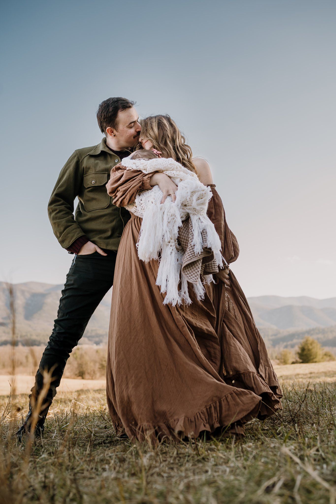 family poses in great smoky mtns for family photos on vacation