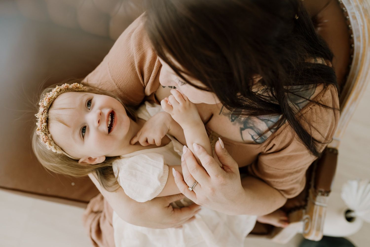 mom plays with her toddler during studio motherhood session