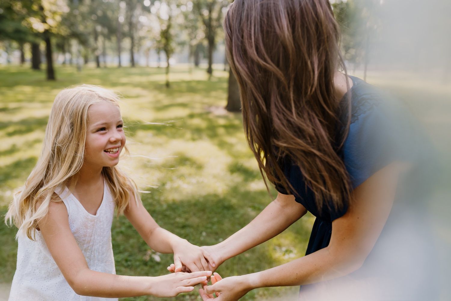 Mom spins around with her daughter playfully