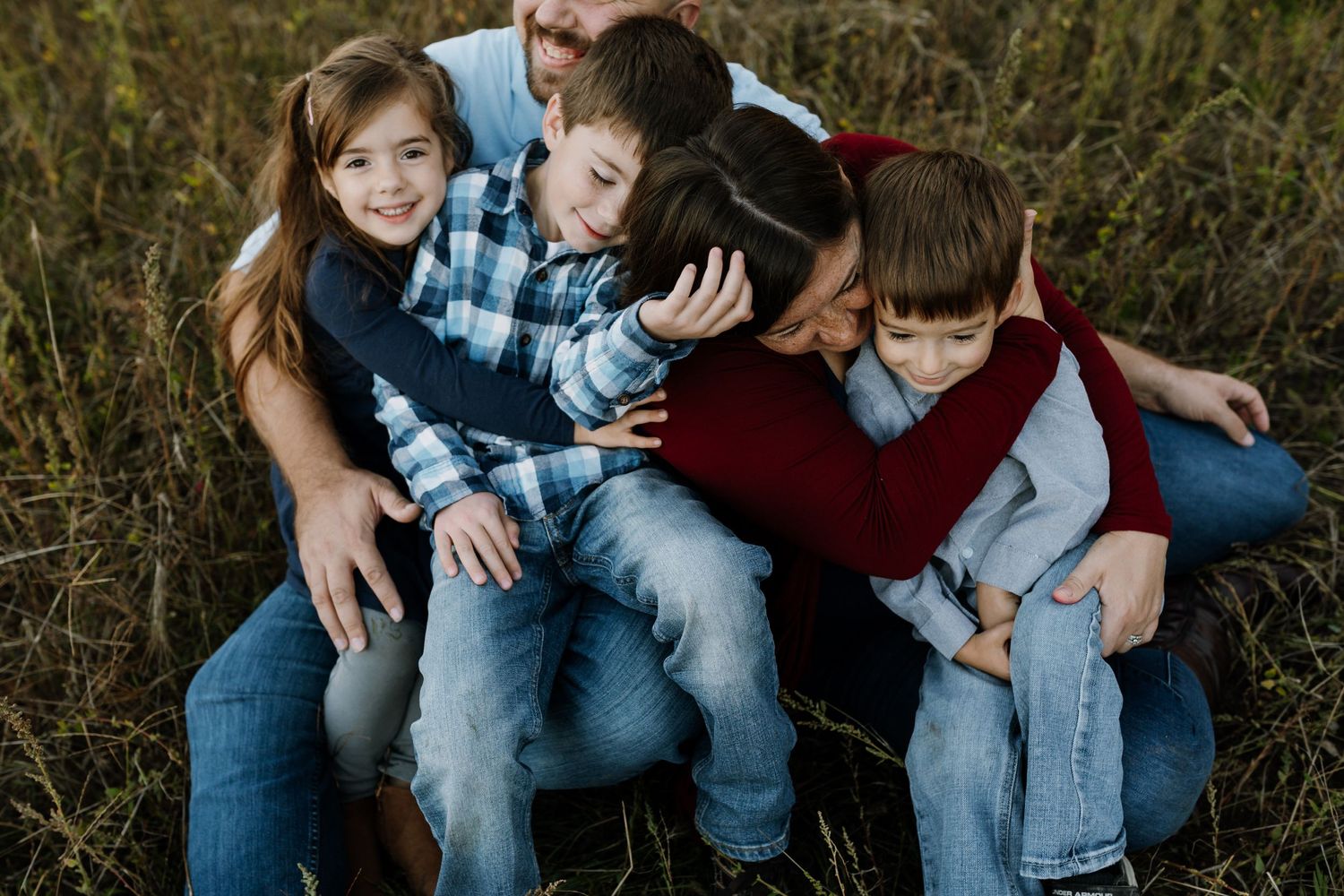 Family plays happily during fun family photography session with Knoxville photographer