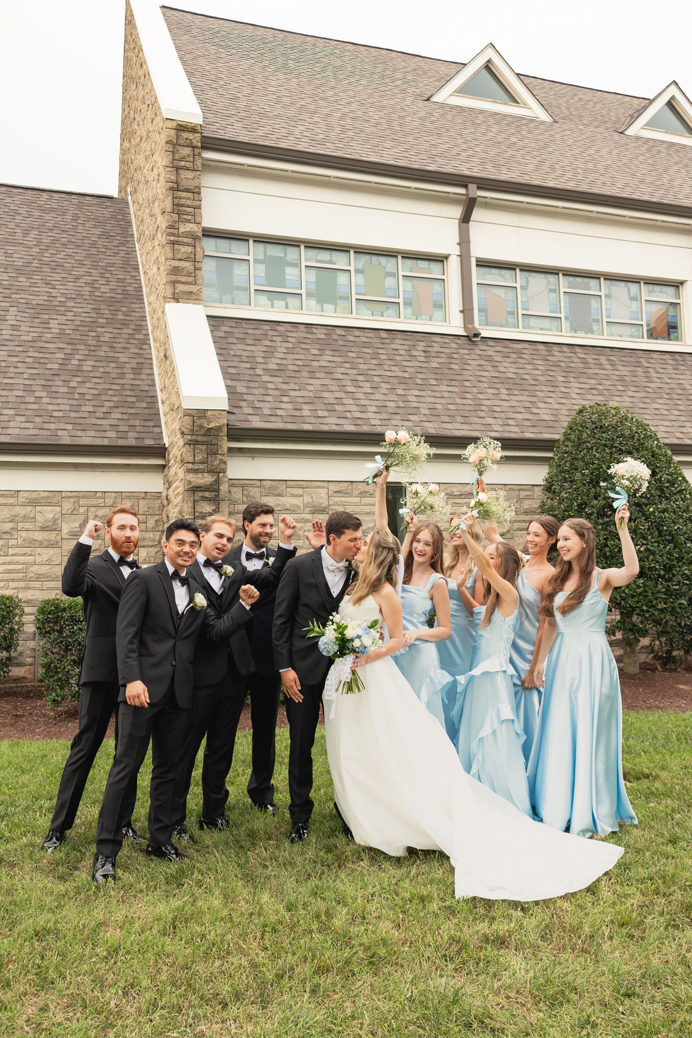 bridal party celebrating the bride and groom at an elegant summer wedding in Nashville Tennessee