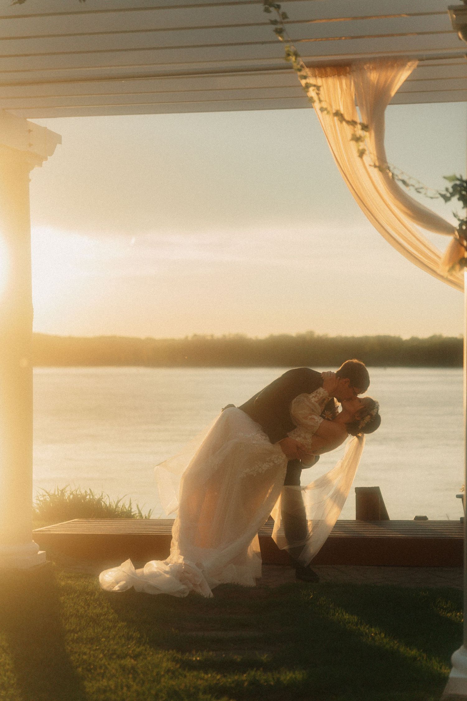 Jonah and Katlyn's sunset kiss after their wedding ceremony on May 4, 2025