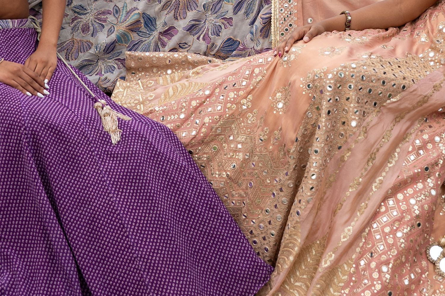 Close-up details of purple and peach sequined formal dresses with intricate beadwork.