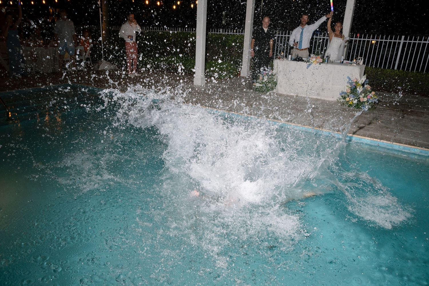 Water splashes dramatically in a pool creating abstract patterns.