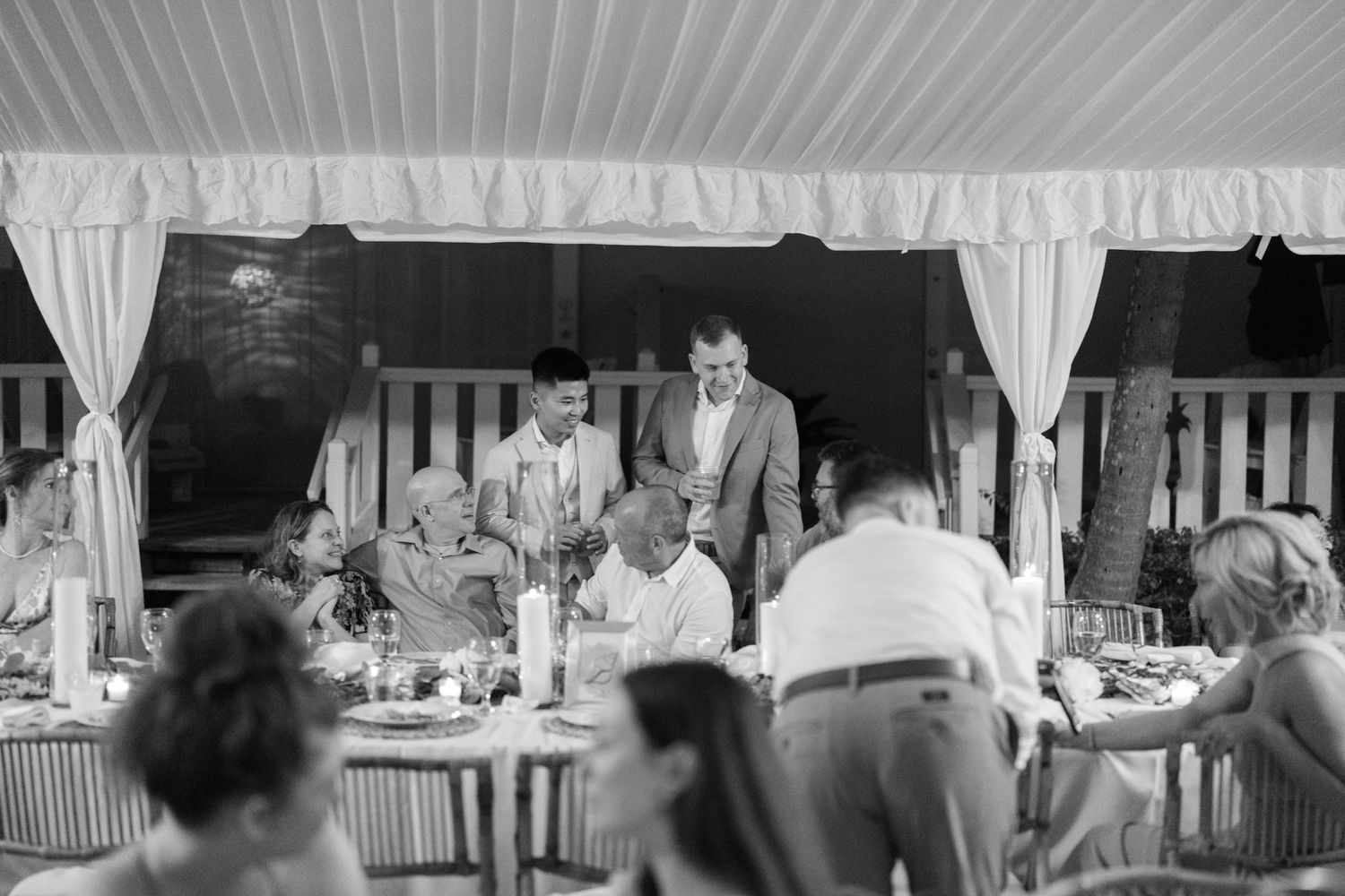 Black and white photographs showing people dining at long tables in what appears to be a formal banquet setting.
