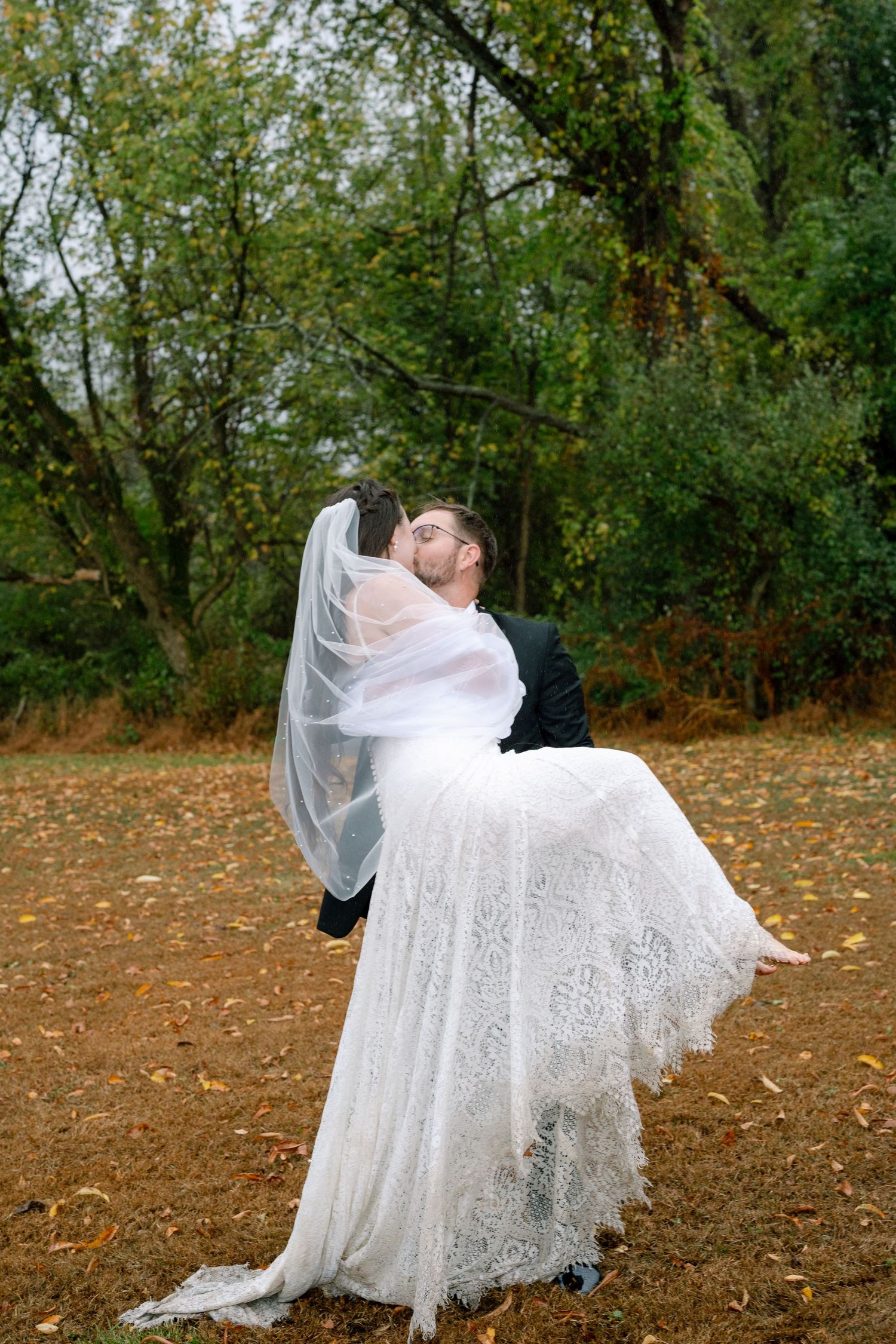 A series of romantic wedding photos showing a couple dancing and twirling in a fall setting with autumn leaves.