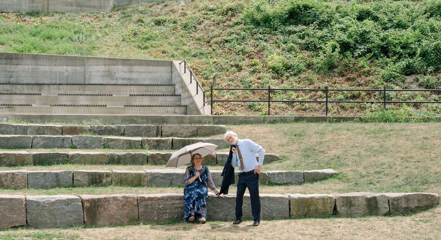 A long concrete staircase with grass and shrubbery visible in a panoramic multi-frame sequence.