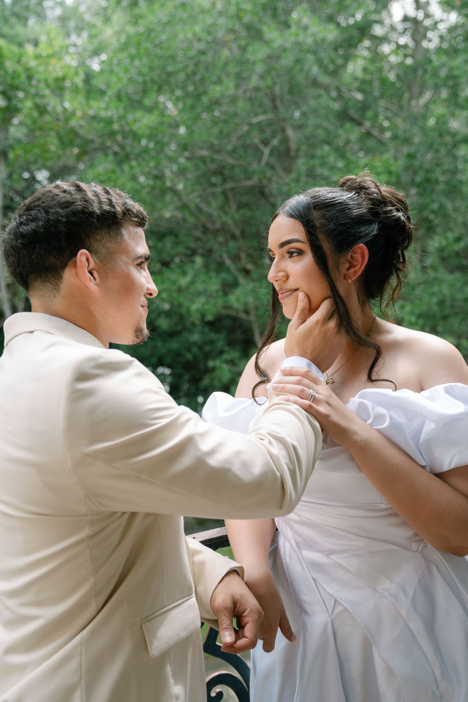 A couple in white attire shares tender moments in a sequence of romantic outdoor photos on a green background.