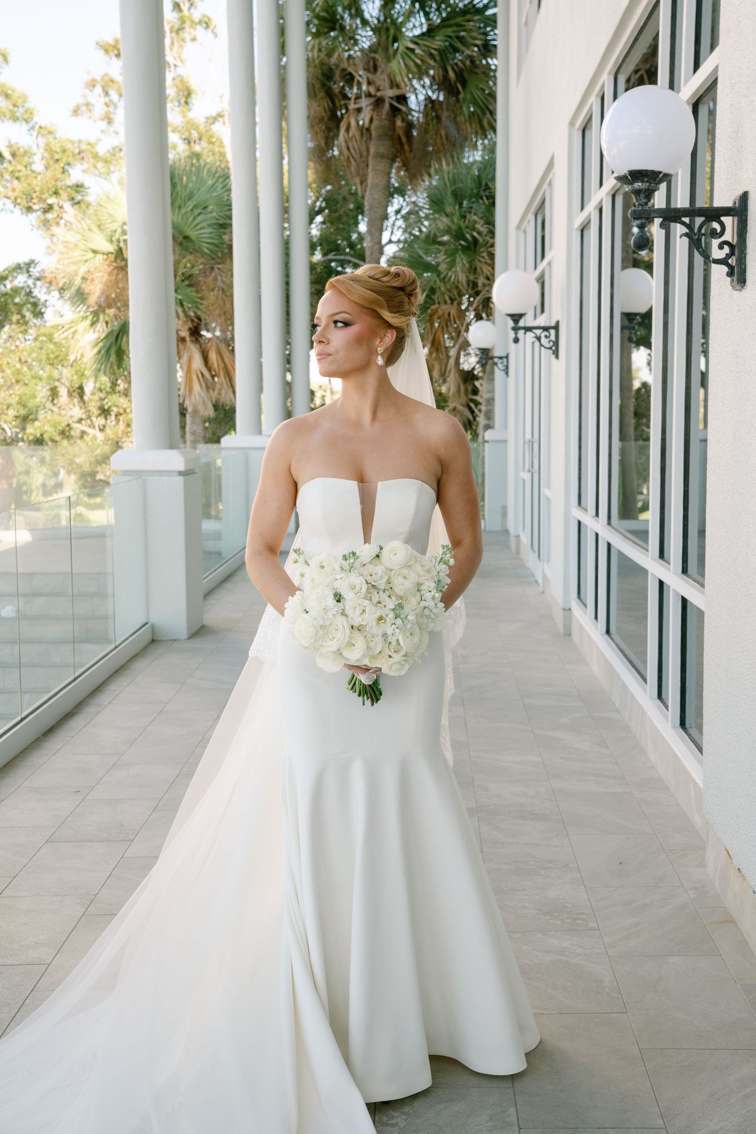 Elegant white ball gown wedding dress photographed in sequence along a columned walkway.