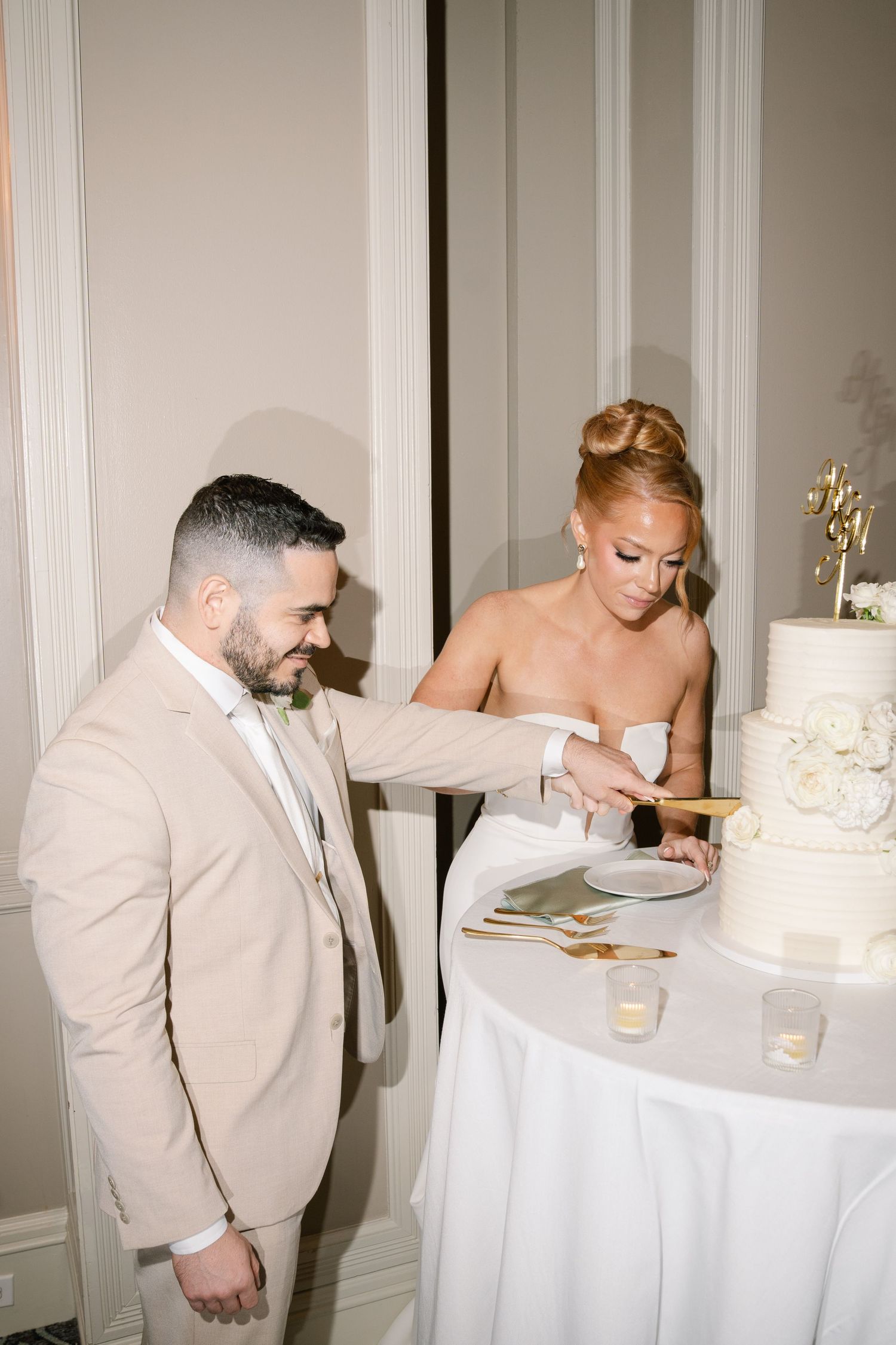 Wedding cake cutting sequence showing couple enjoying their first slice together.