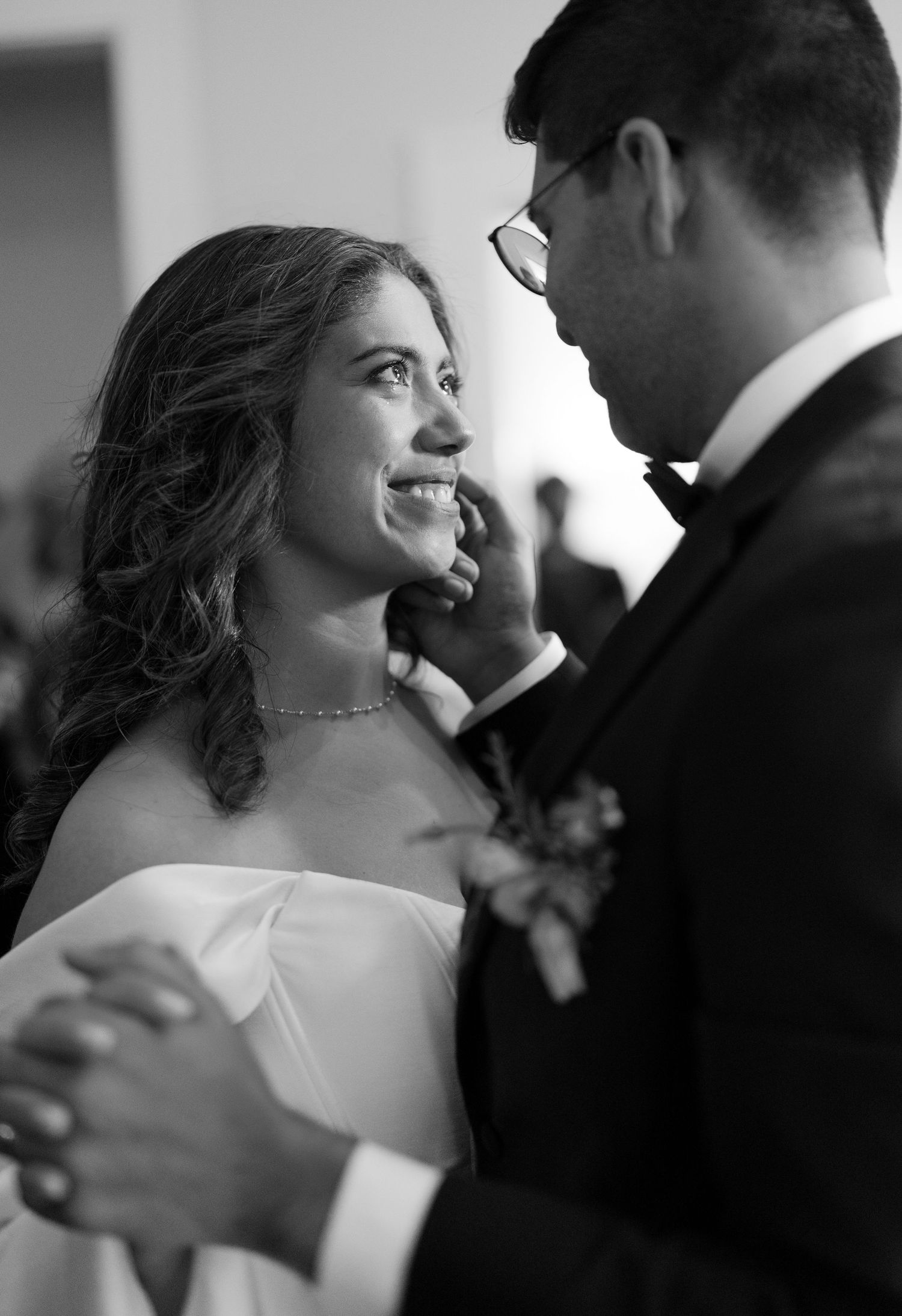 Black and white wedding photography sequence showing intimate moments between newlyweds dancing at their reception.