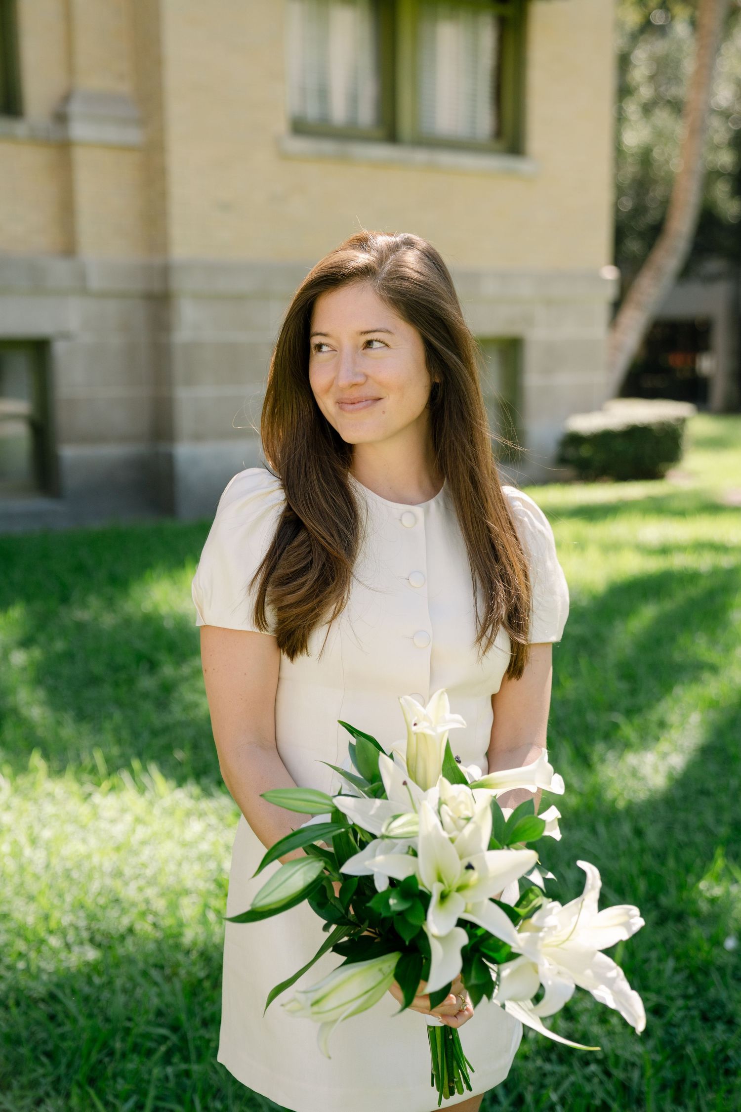 A bridal portrait series showing a woman in white holding elegant white lily bouquet against a garden backdrop.
