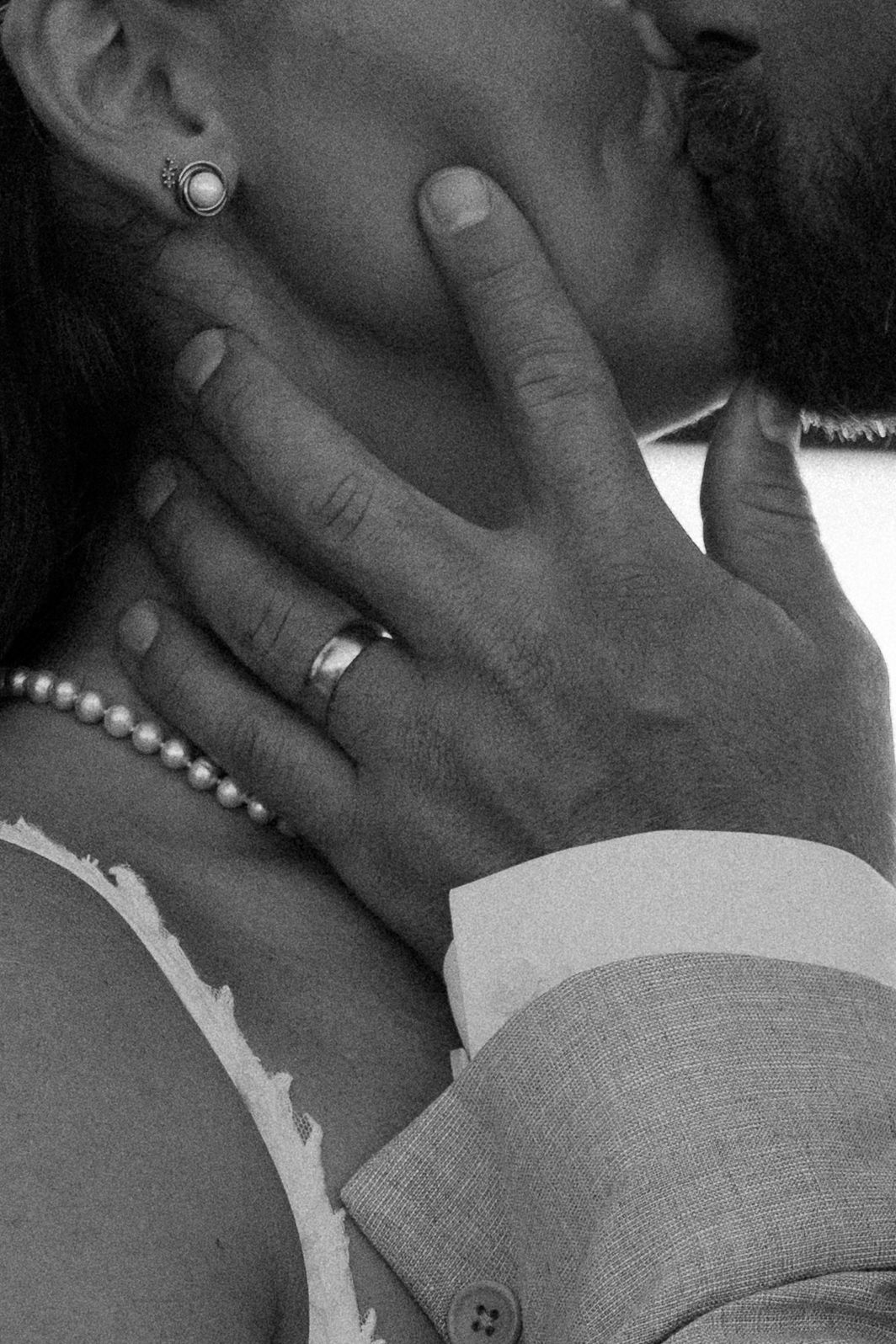 A black and white photo sequence showing two people sharing an intimate kiss.