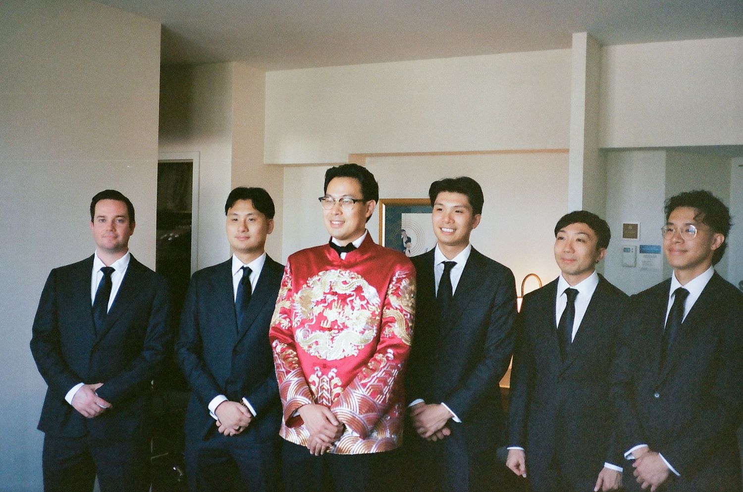 A series of formal group photos showing people in suits and traditional dress arranged in rows.
