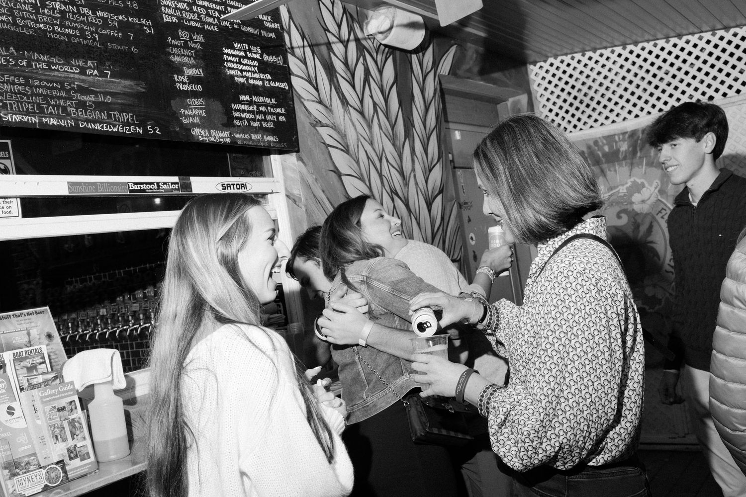 A collection of vintage black and white photographs showing people in various social interactions and gatherings.