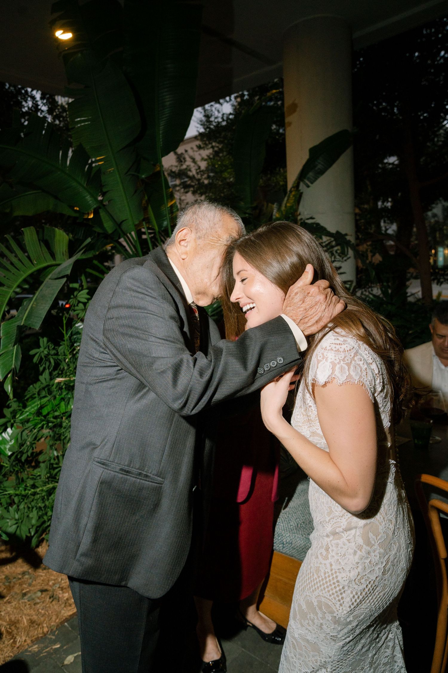 Couple sharing an intimate dance moment at an evening celebration.