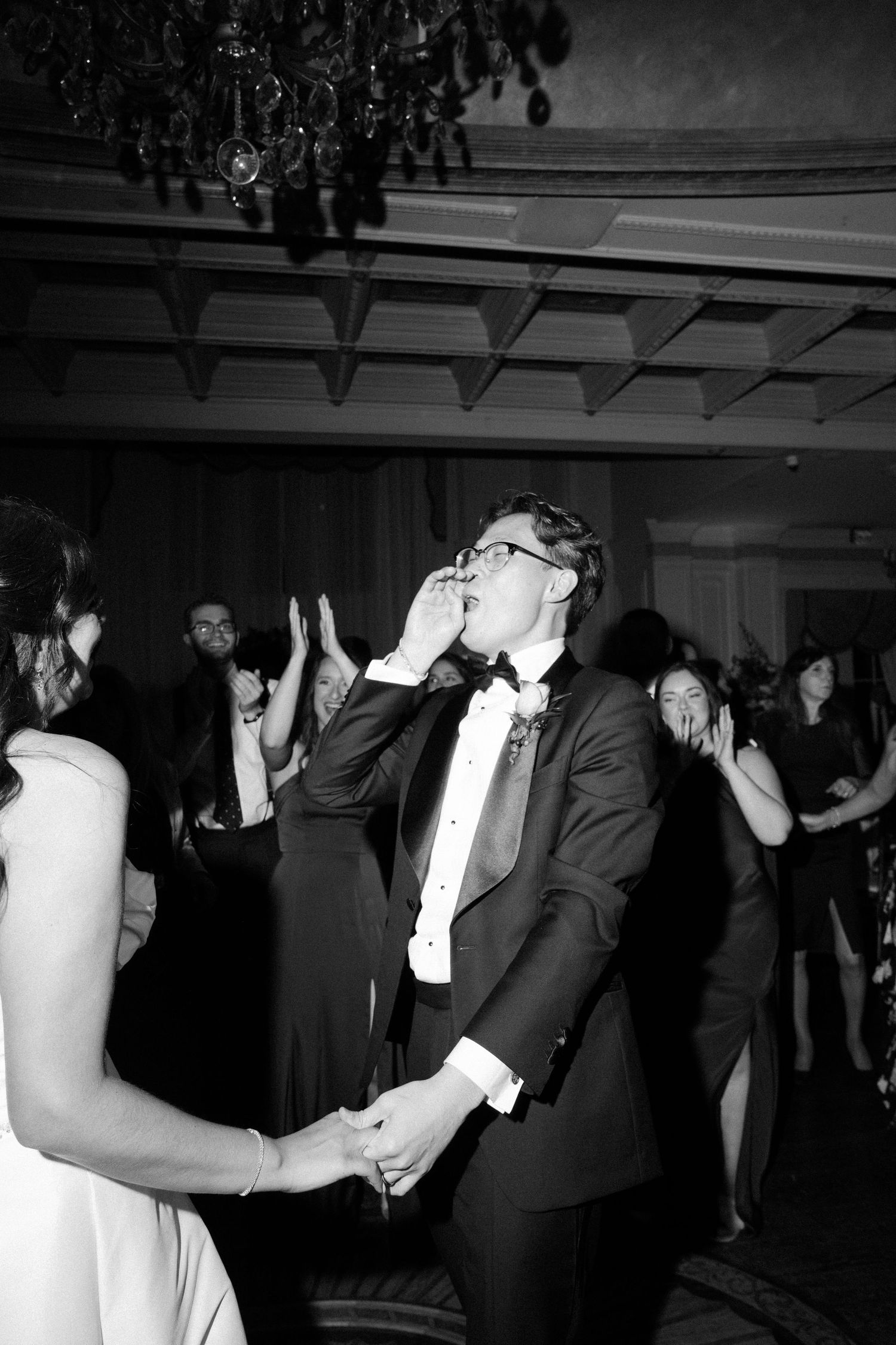Black and white photos of couples dancing in formal attire at an evening wedding reception.