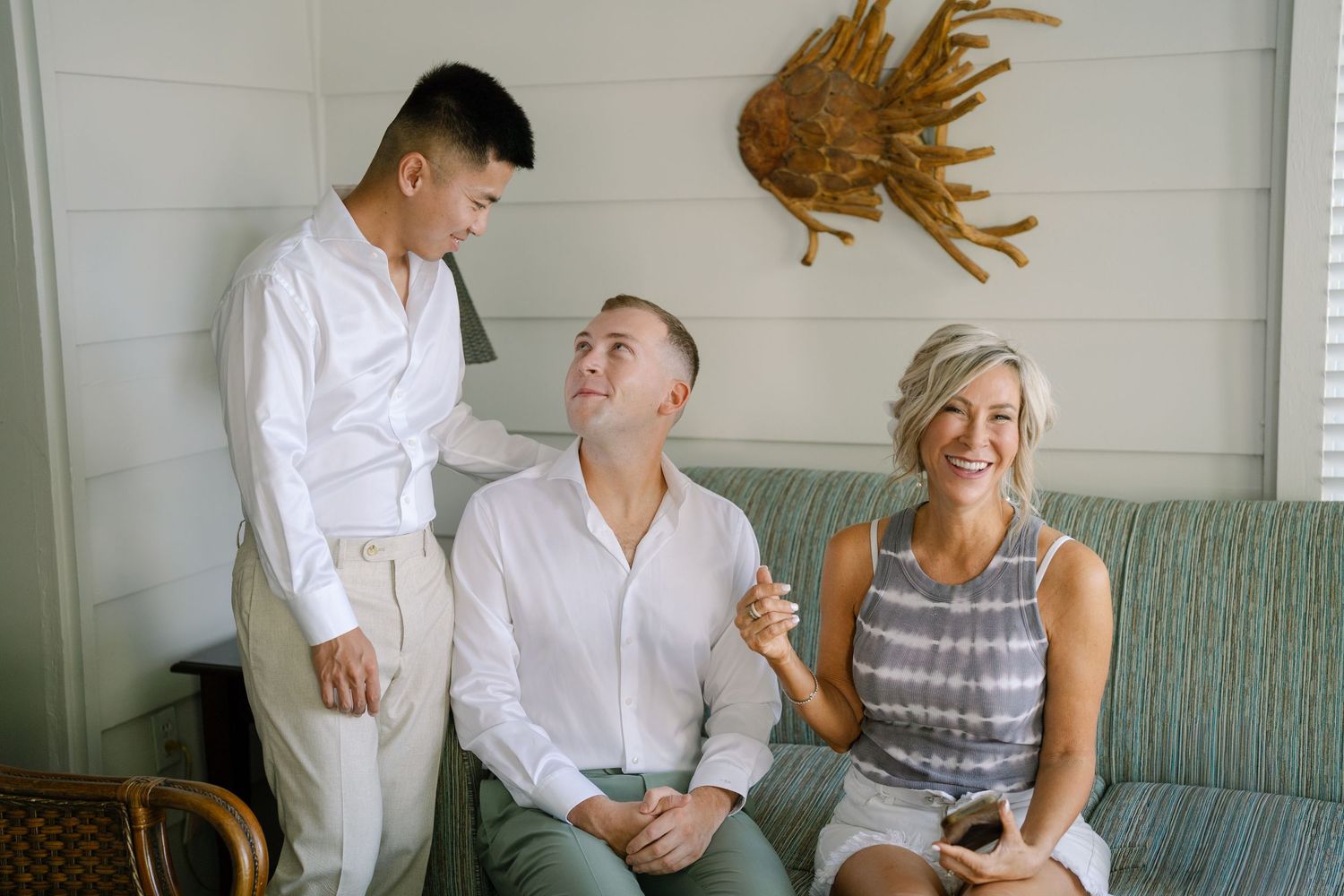A series of candid lifestyle photos showing joyful moments and laughter between people on a couch.